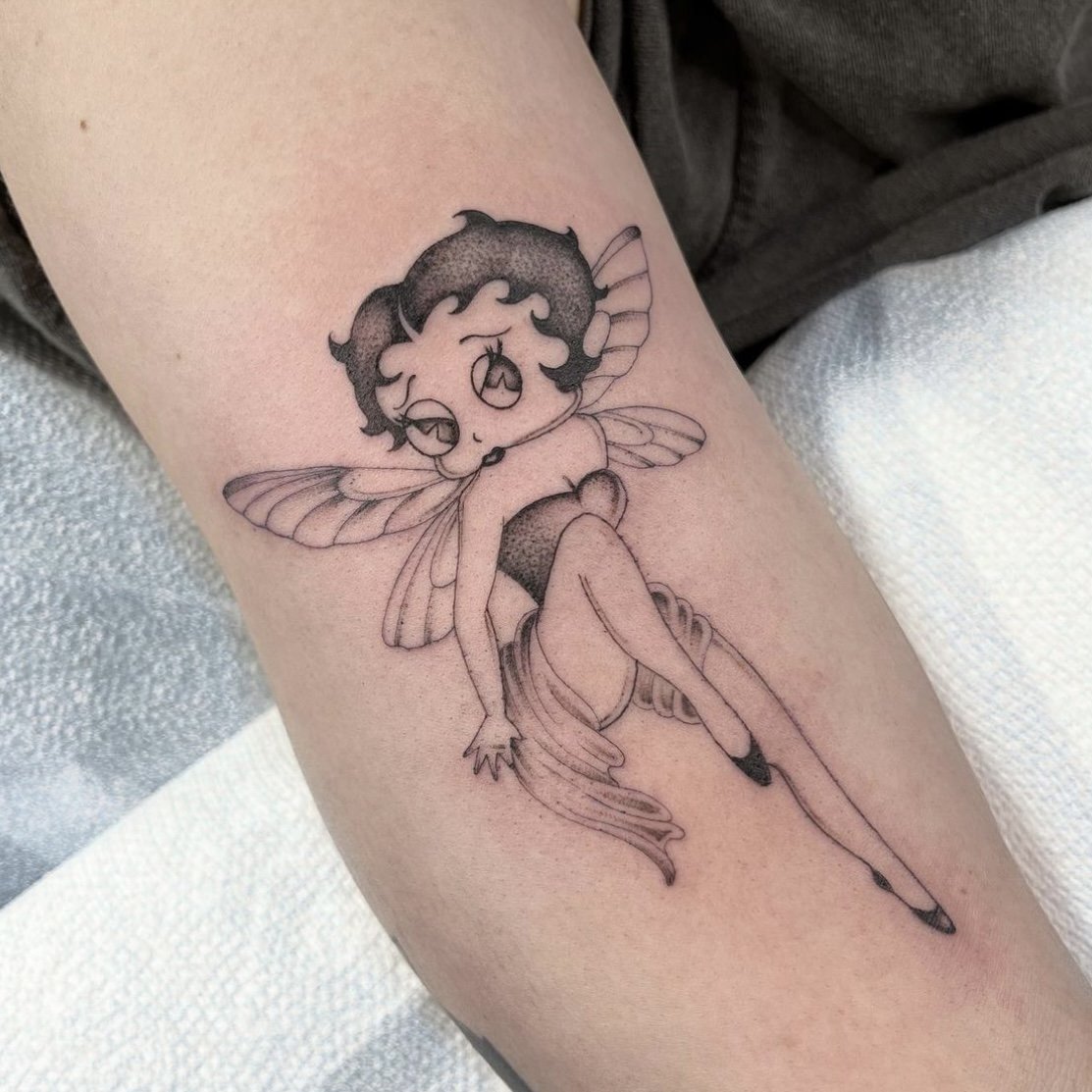 Betty Boop tattoo done on the upper arm