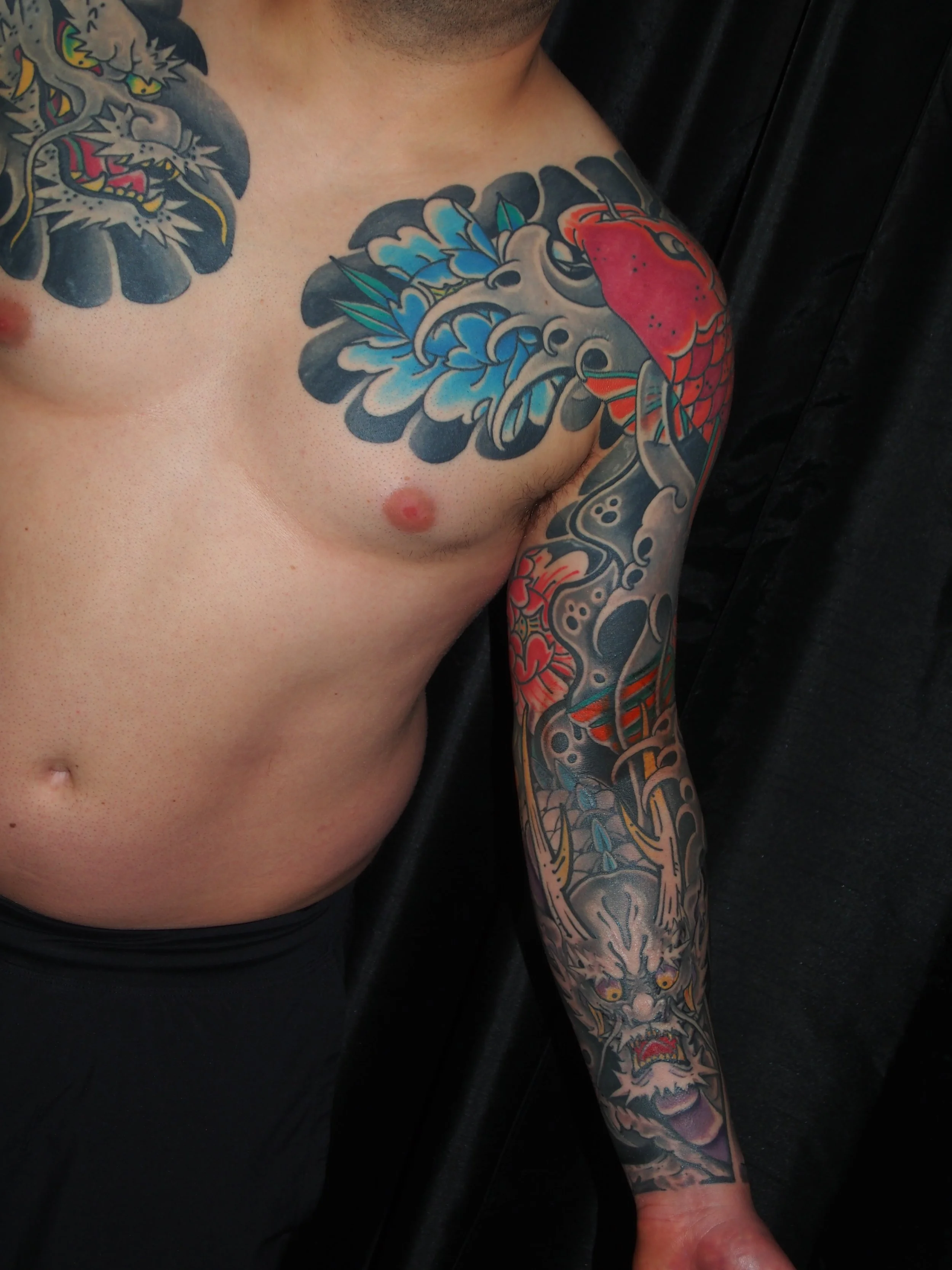 Japanese irezumi koi and dragon sleeve tattoo by Dominic Vasquez at Superfly Tattoo in San Diego, California