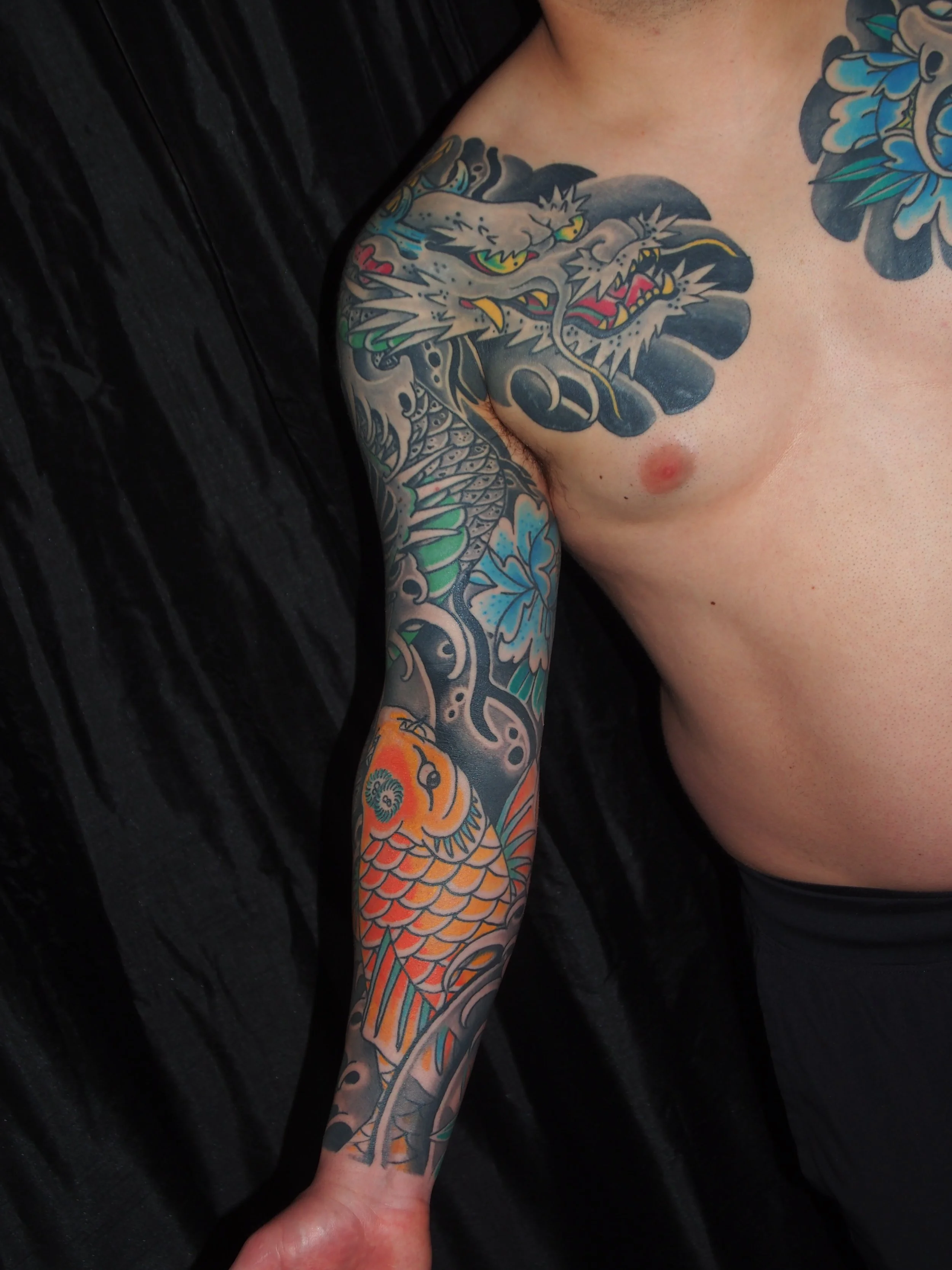 Japanese irezumi koi and dragon sleeve tattoo by Dominic Vasquez at Superfly Tattoo in San Diego, California