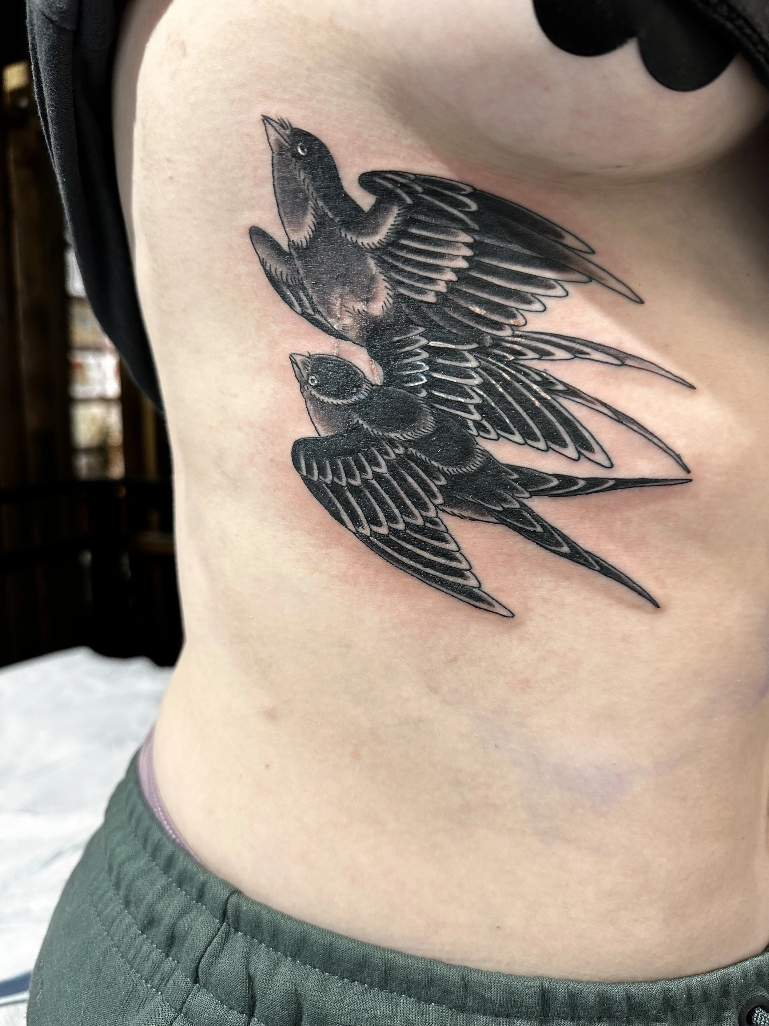 Black and grey sparrow coverup tattoo by Dominic Vasquez at Superfly Tattoo in San Diego, California
