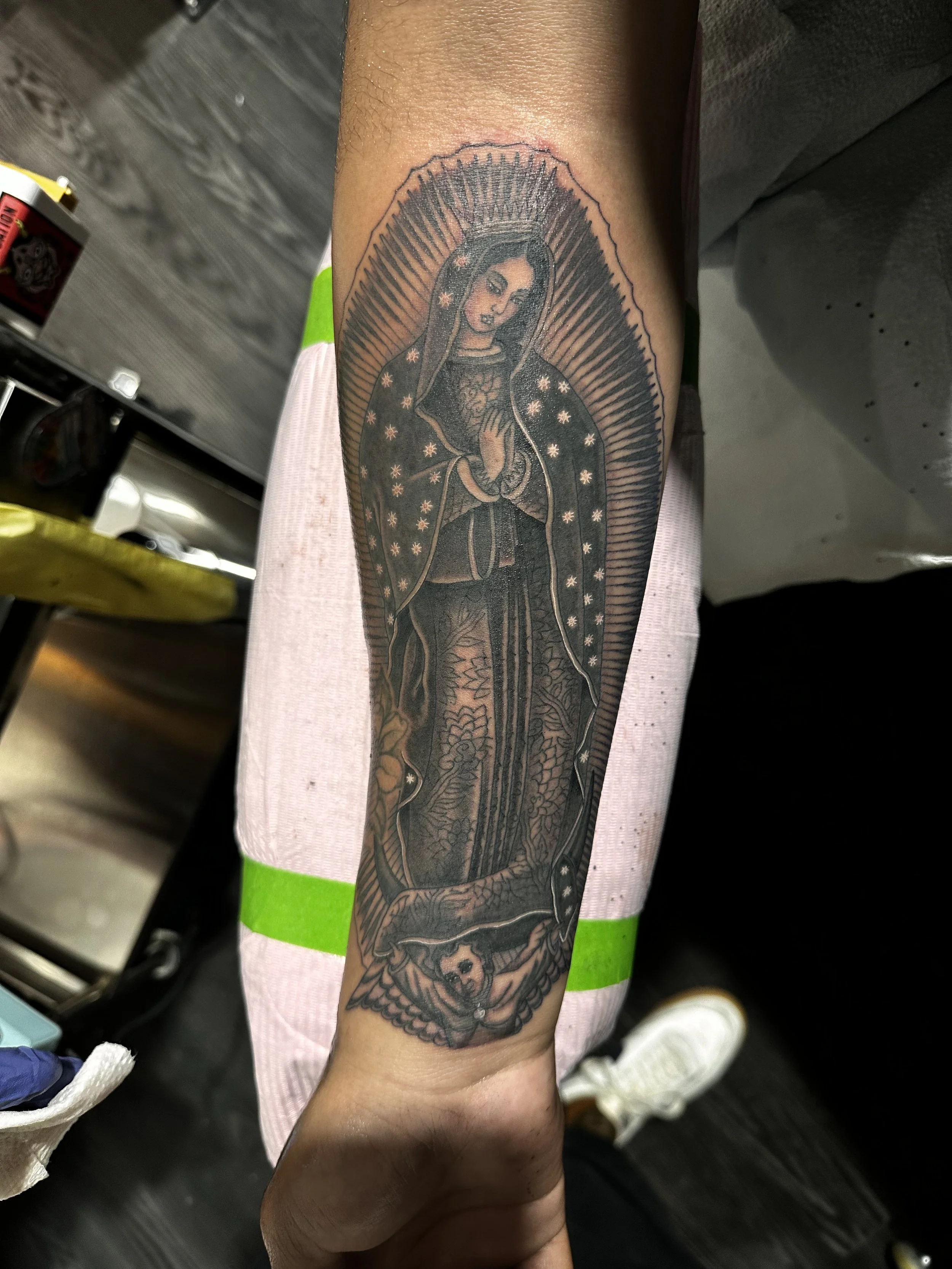 Black and grey chicano realism guadalupe tattoo by Dominic Vasquez at Superfly Tattoo in San Diego, California