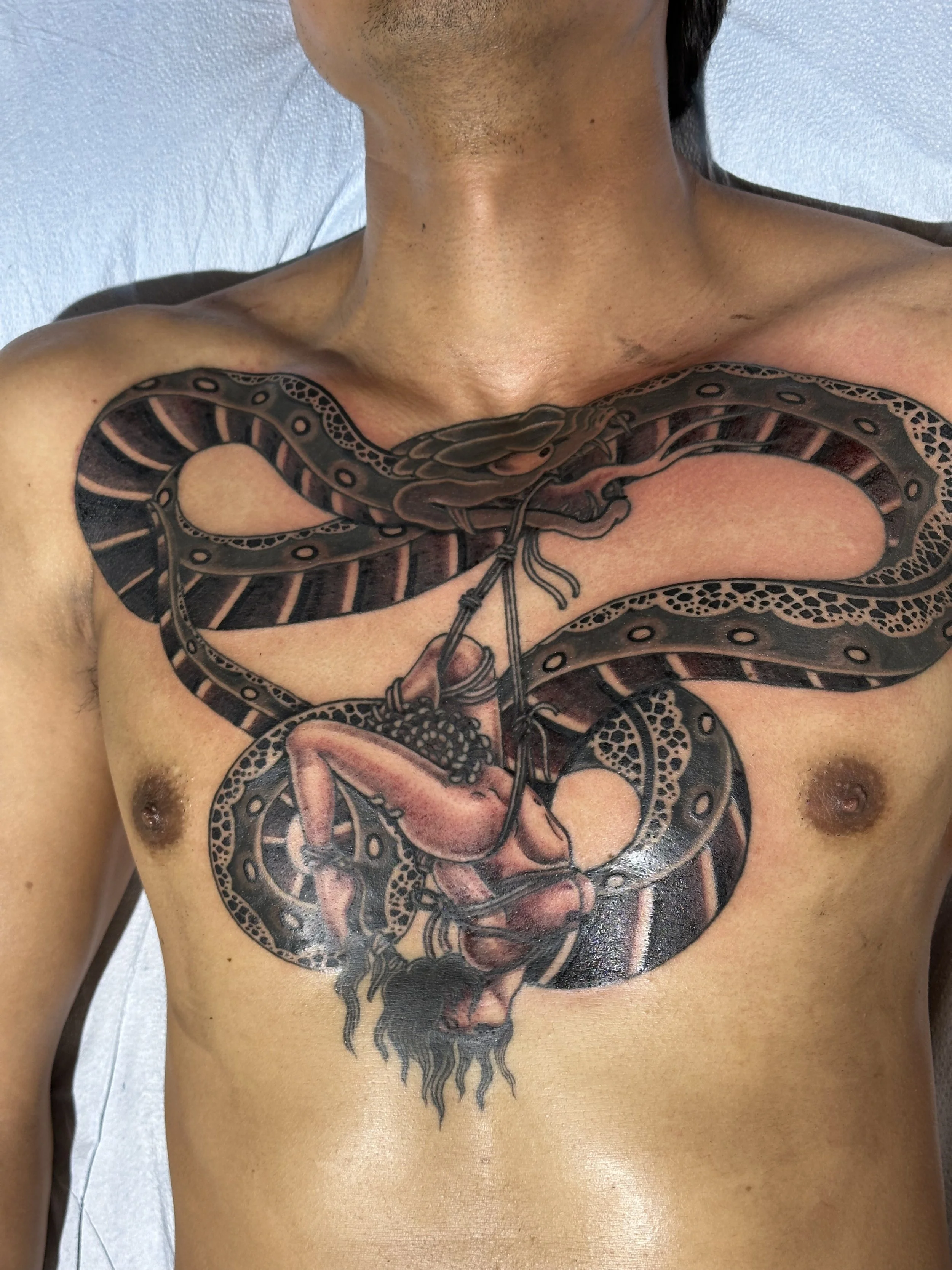 Japanese irezumi snake shibari chest tattoo by Dominic Vasquez at Superfly Tattoo in San Diego, California