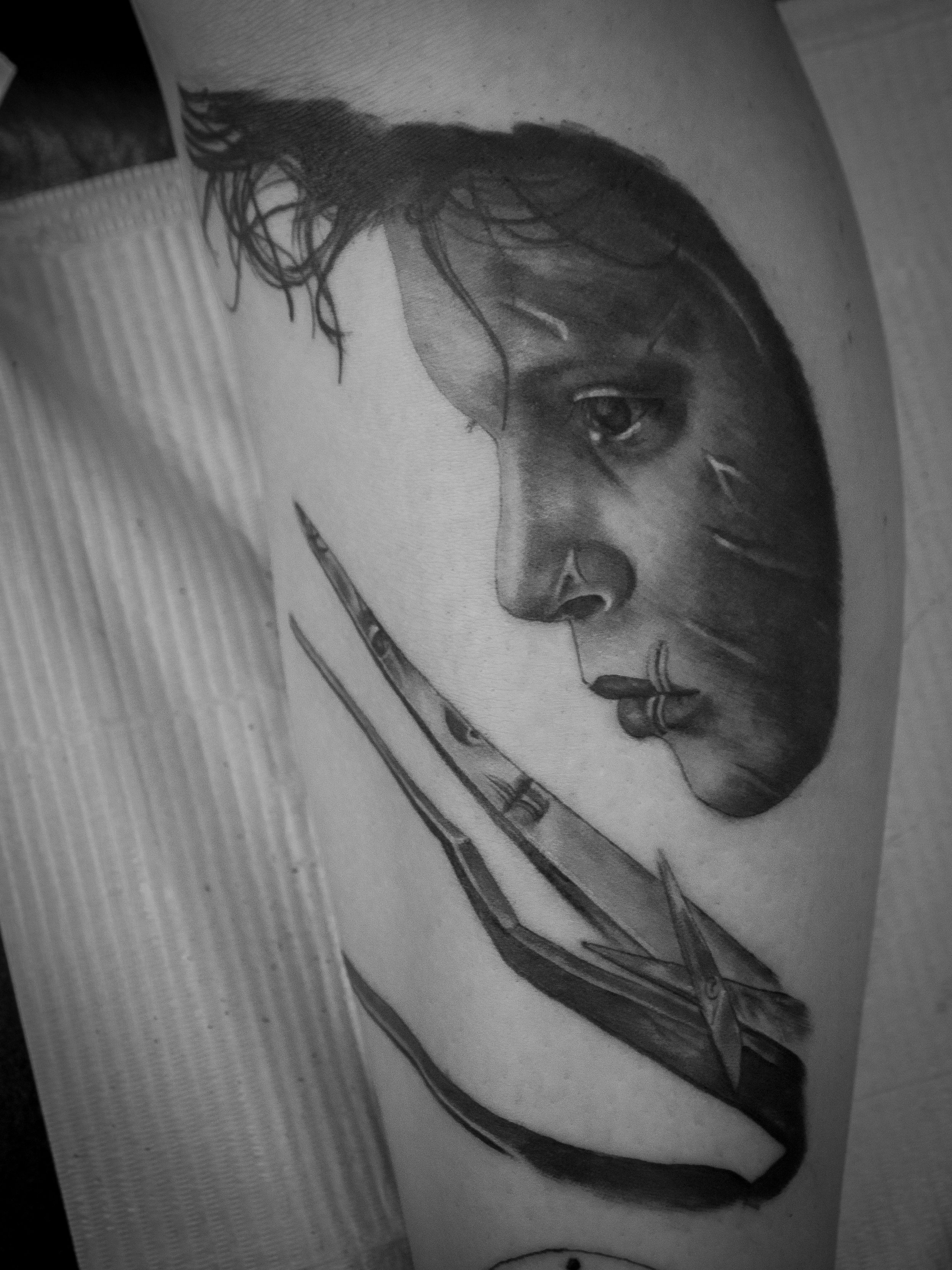 black and grey realism edward scissor hands portrait tattoo by Dominic Vasquez at Superfly Tattoo in San Diego, California