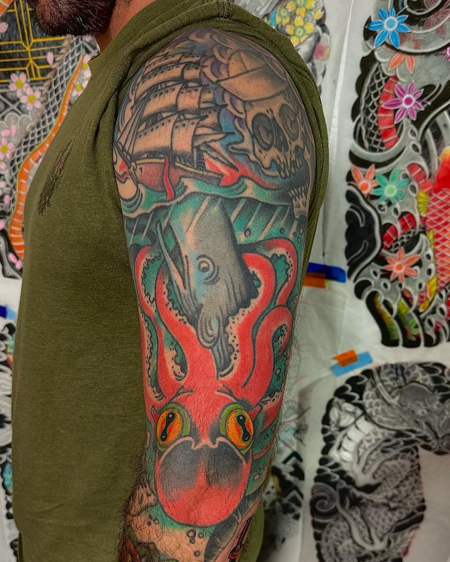 American traditional kraken and ship half sleeve tattoo by Dominic Vasquez at Superfly Tattoo in San Diego, California