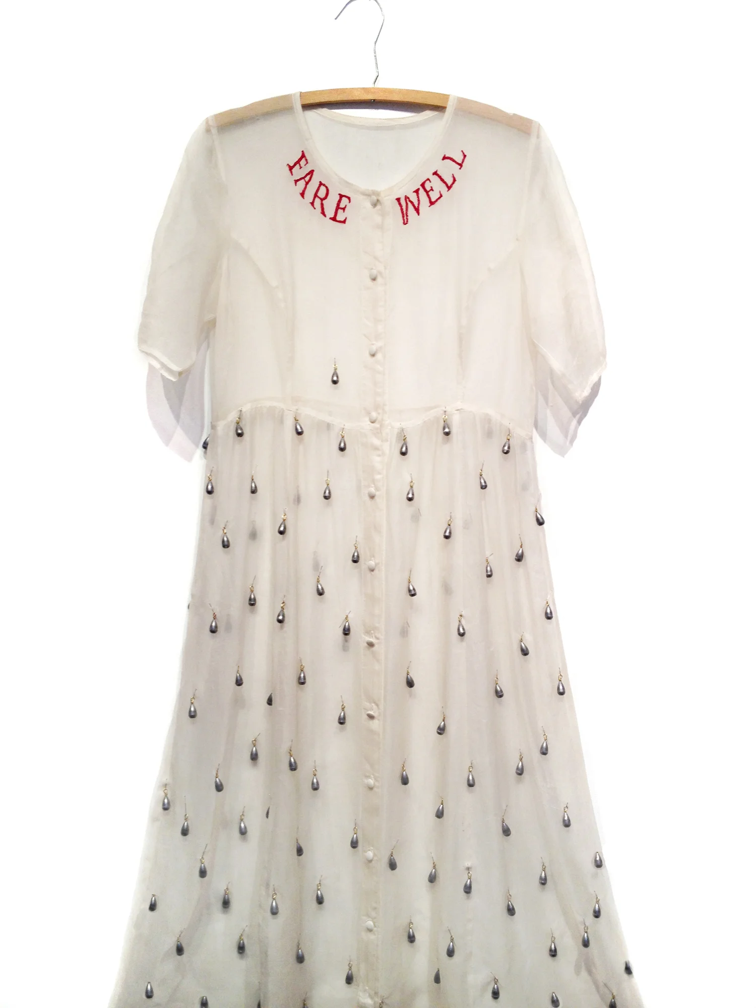 Susan Jamison, Drowning Dress, silk, cotton floss, lead weights, 58”x22”x8”, 2013 