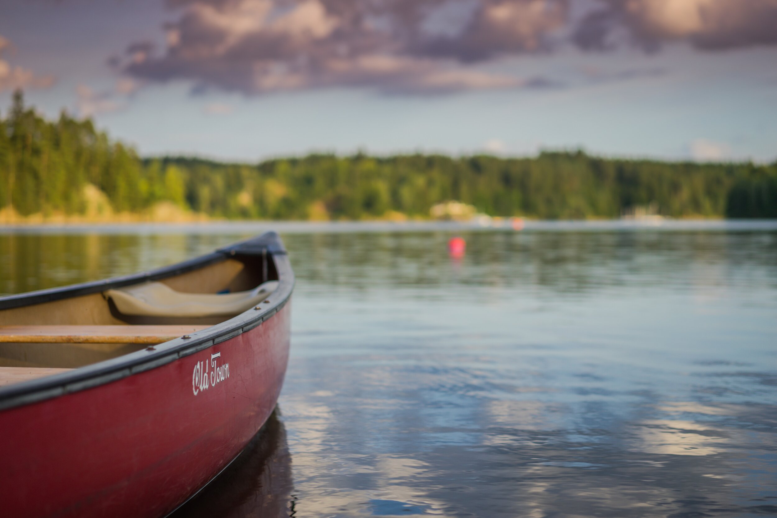 Red Canoe on Lake - Michael Niessl - Unsplash.jpg