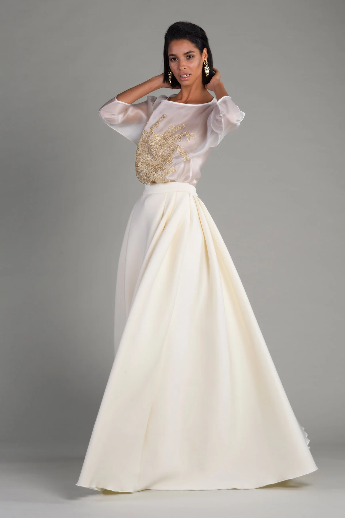 Designed By Rakan Shams Aldeen and Lamia AlOtaishan, the spring summer 16 collection aimed to introduce our image for the strong modern women by using Different Volumes and different kinds of fabrics such as organza, satin, chiffon and crepe. and of course lace was one of the main materials and show our hand craftsmanship into details that gives the design a strong and modern look for every women to feel unique, special and confidant. You can see a lot of soft colours such as pastels, whites with pop of natural colours.