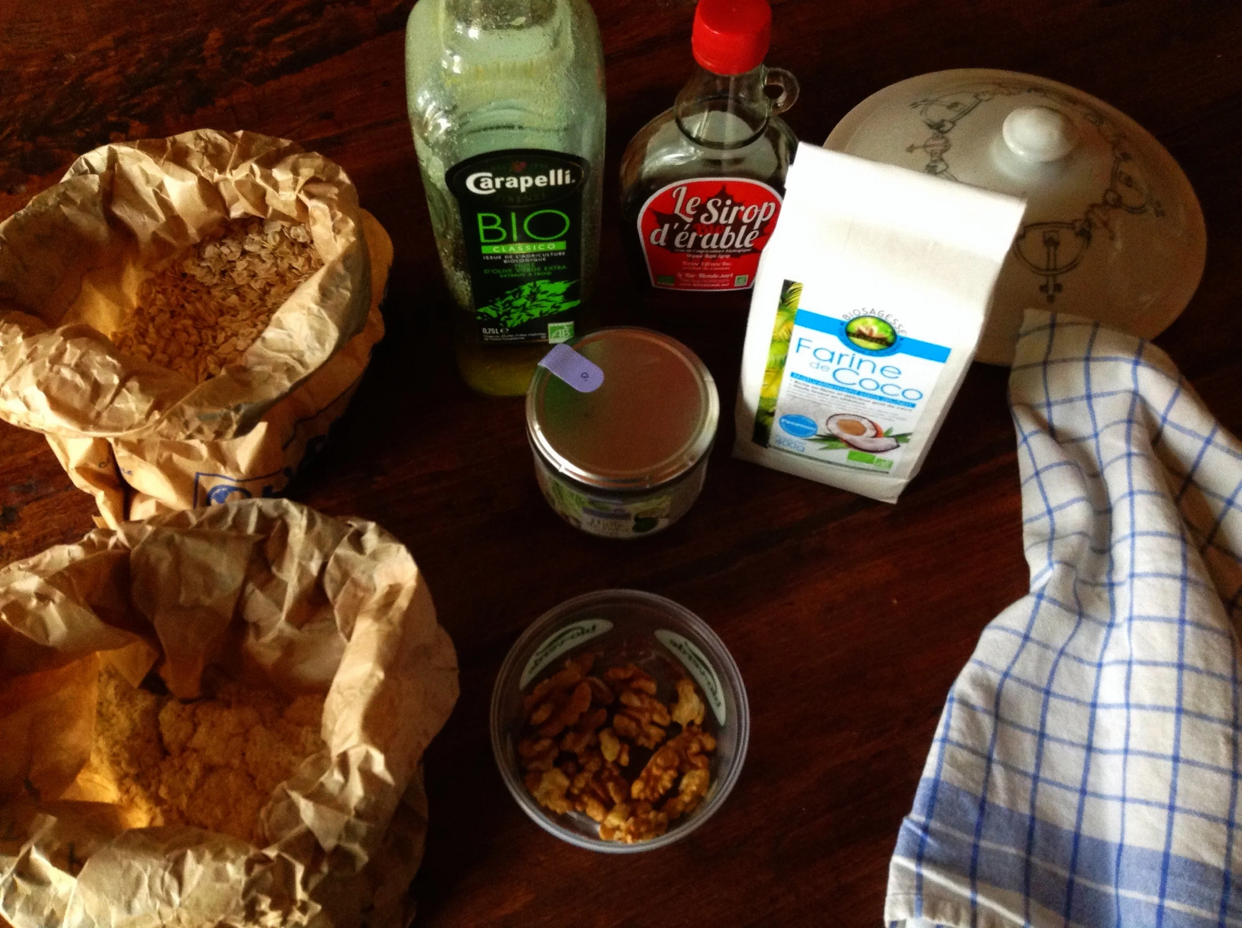 My ingredients, counterclockwise from bottom: walnuts, spelt flour, oats,olive oil, coconut oil, maple syrup, and coconut flour. All Organic