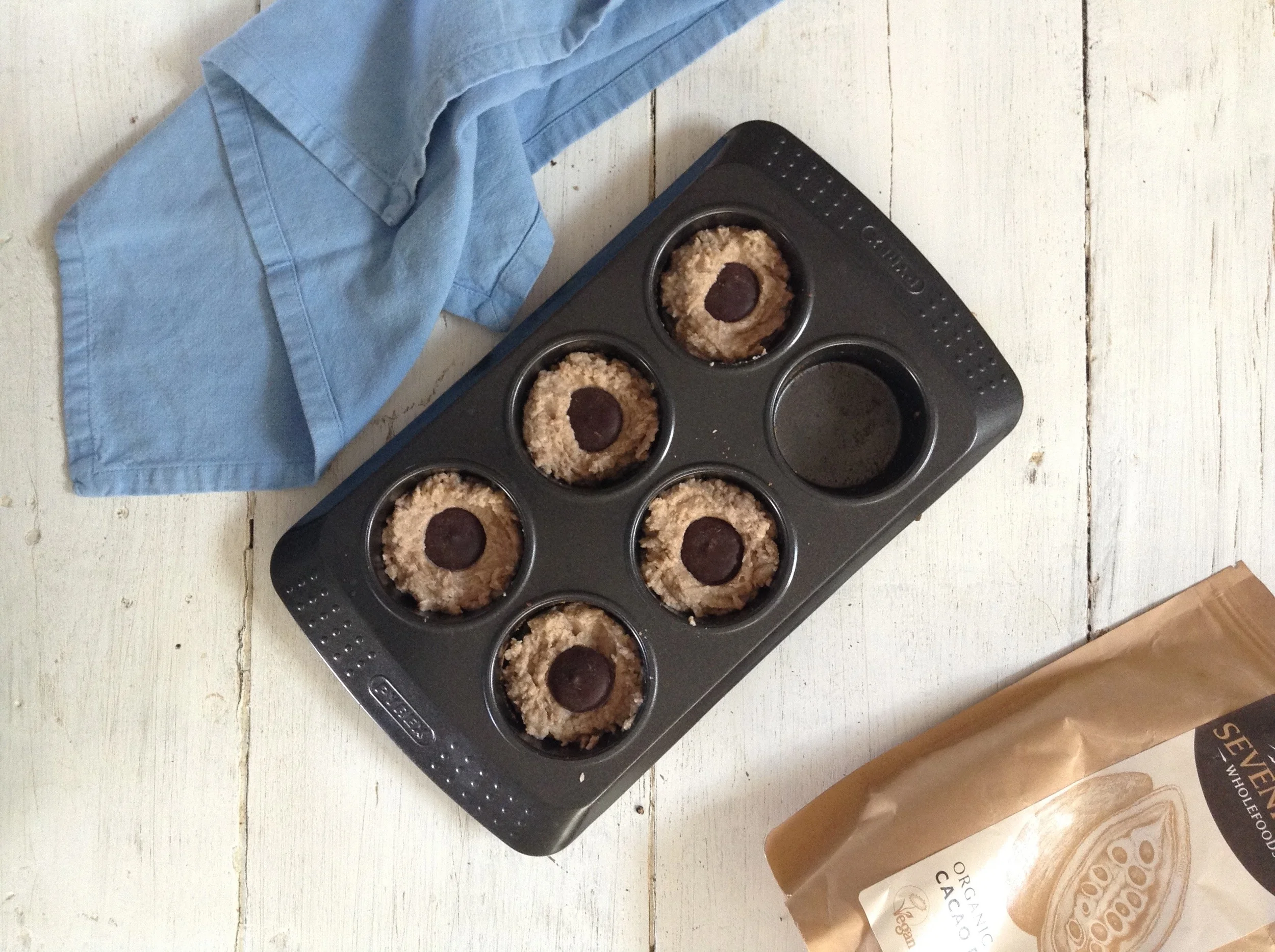 Push Cacao paste wafers gently into center of muffin