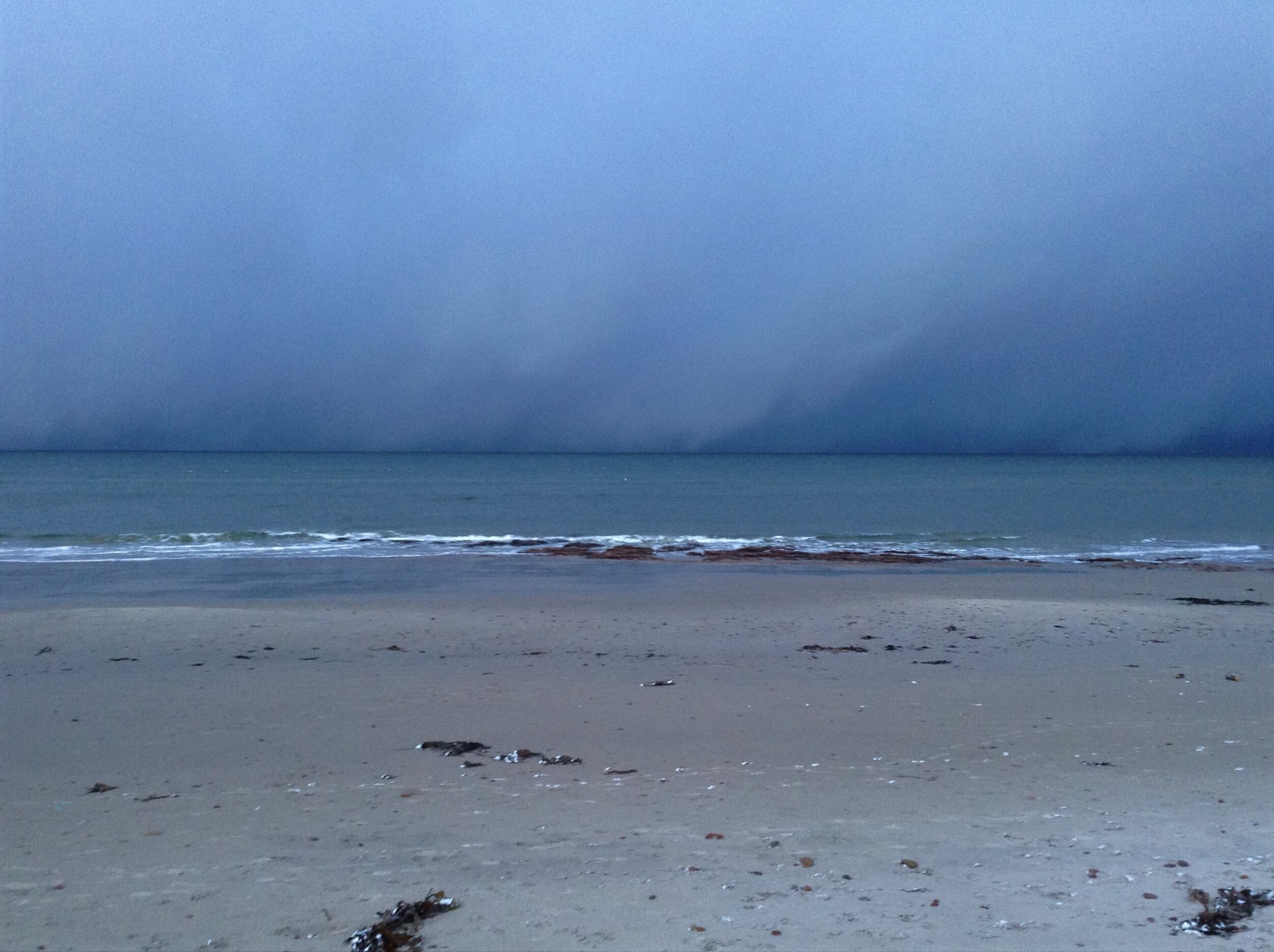 Snow filled skies, Nairn Central Beach. Nairn, Scotland.