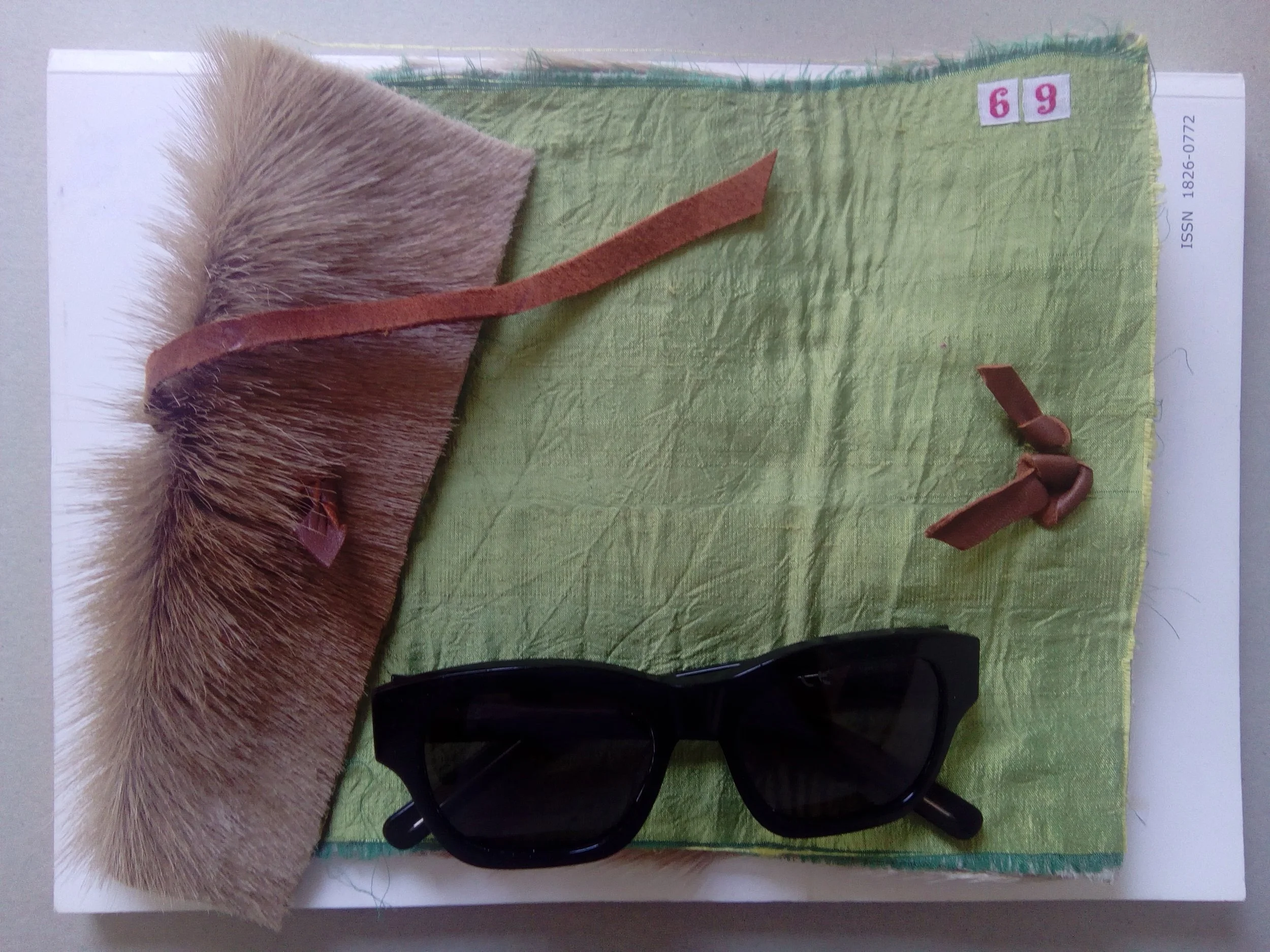 Exhibit E: A wallet or notebook, crafted by Mr creeP from the skin of some unfortunate animal (roadkill?)