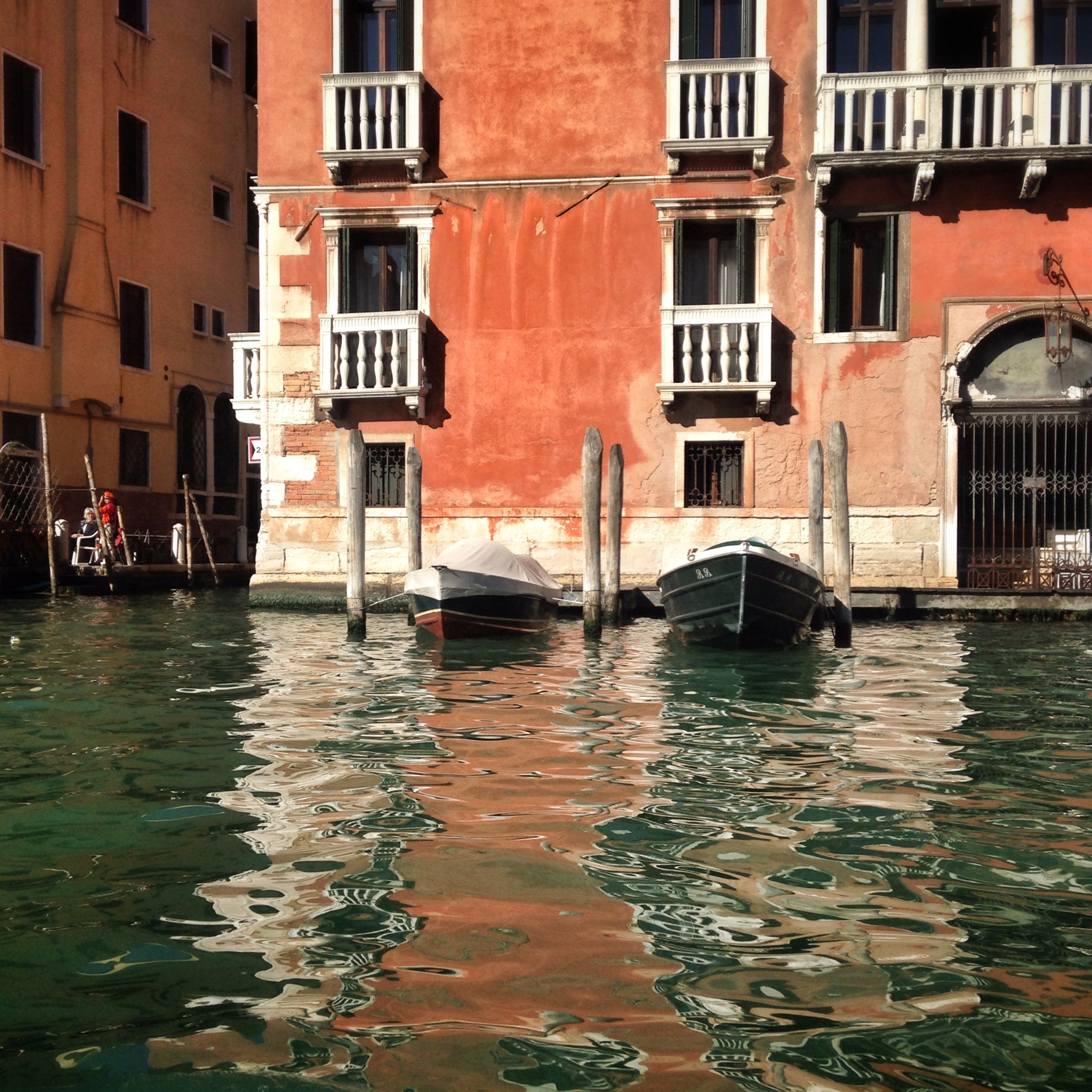 Fiery stucco walls by the water | EAT.PRAY.MOVE Yoga | Venice, Italy