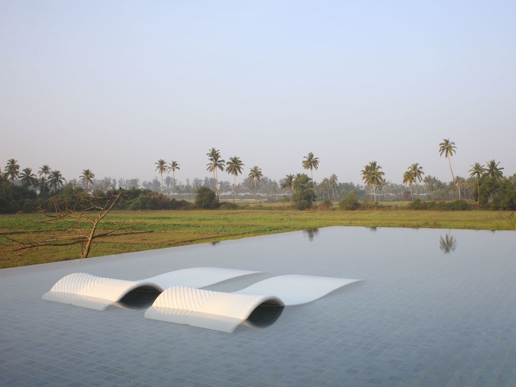 Loungers in the pool | EAT.PRAY.MOVE Retreats | Goa, India