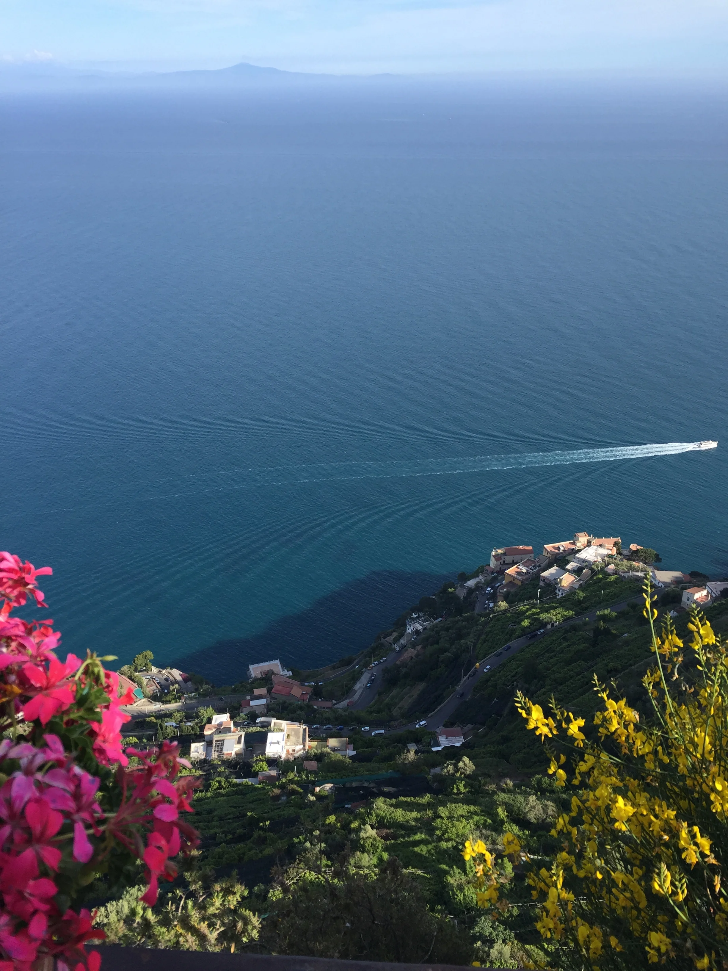 Boats skimming the Positano coast EAT.PRAY.MOVE Yoga Retreats | Amalfi Coast, Italy