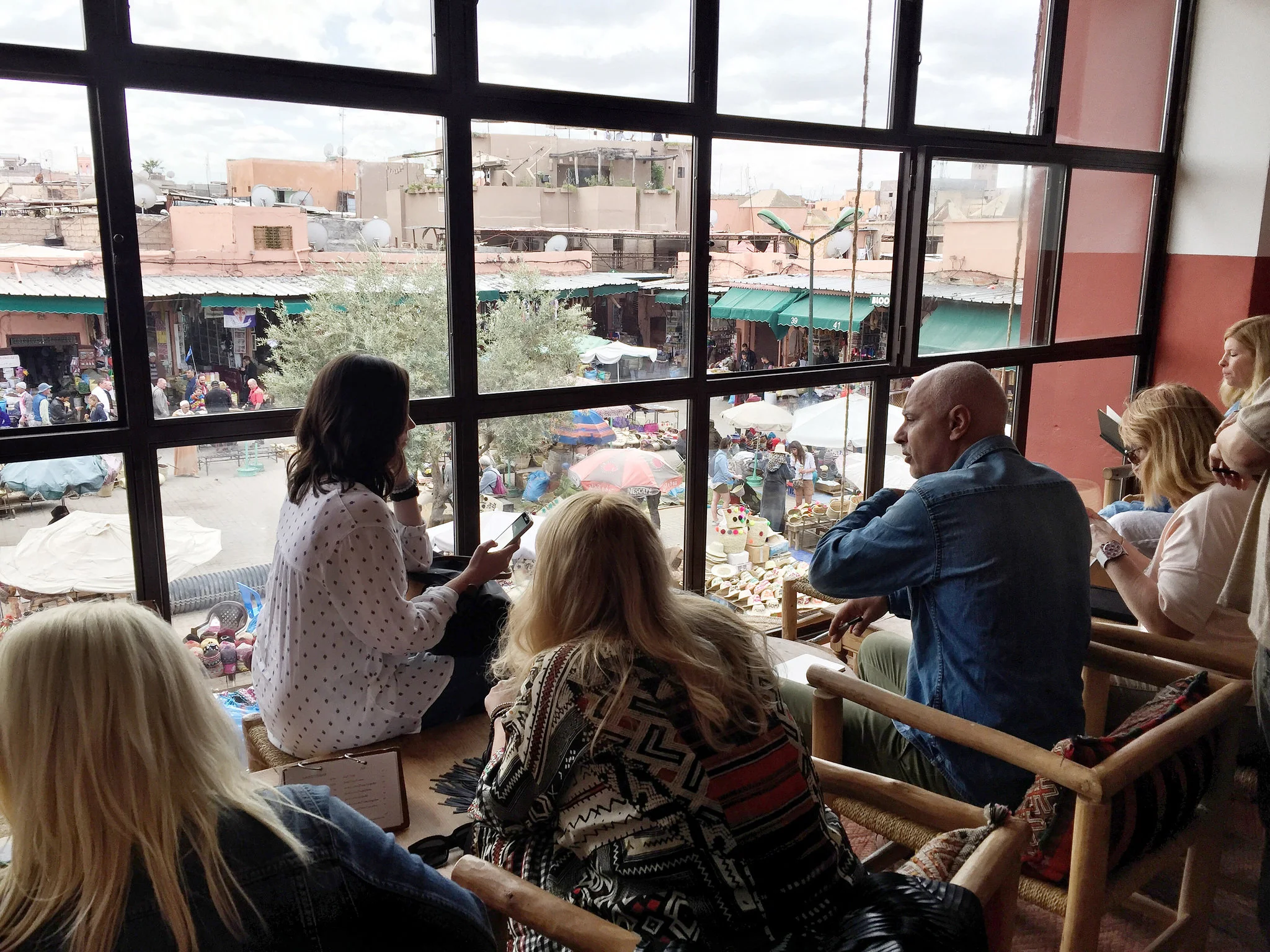 Guests overlooking the Marrakech Medina | EAT.PRAY.MOVE Yoga Retreat | Marrakesh, Morocco