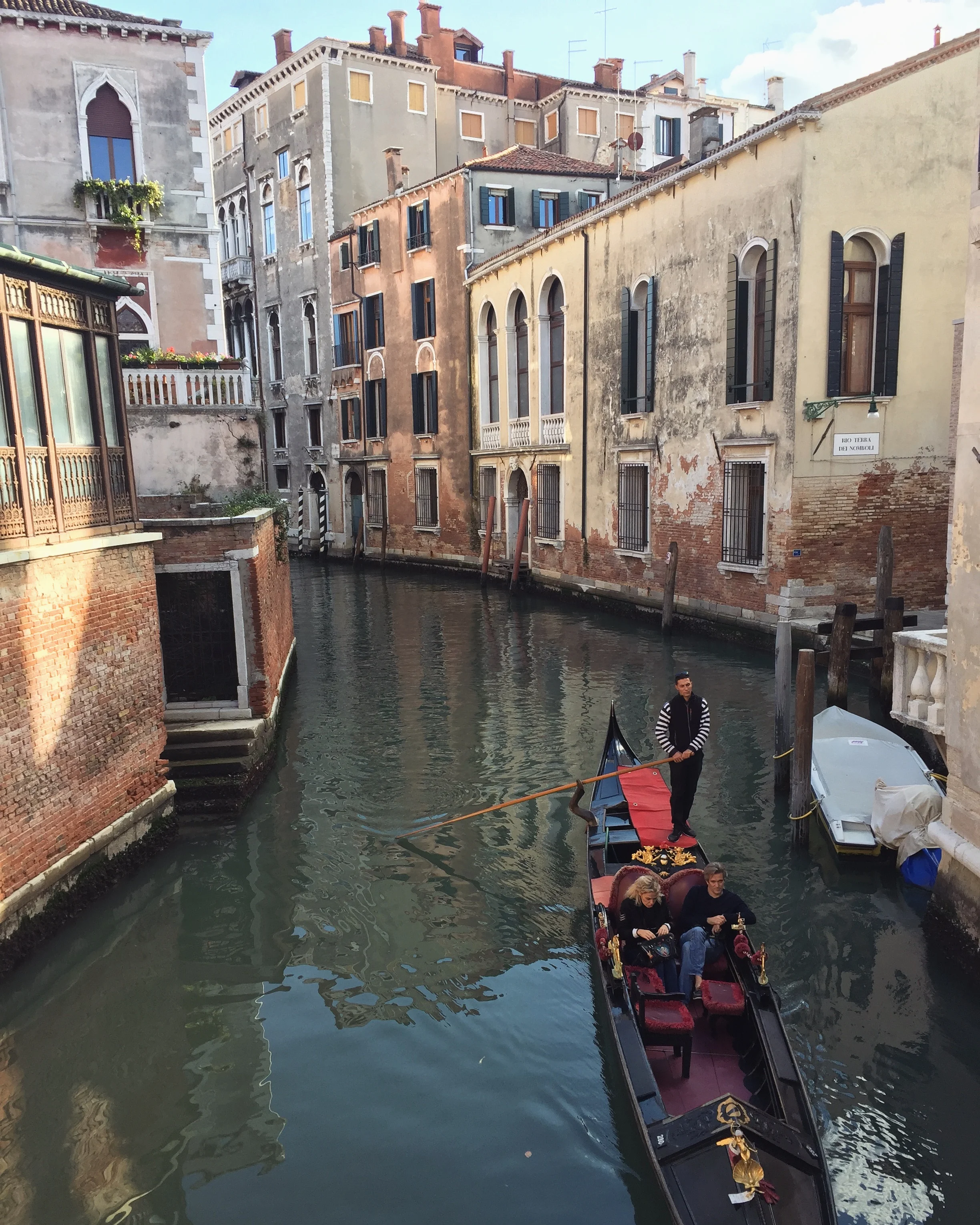 Gondolier taking visitors down the canals EAT.PRAY.MOVE Yoga | Venice, Italy
