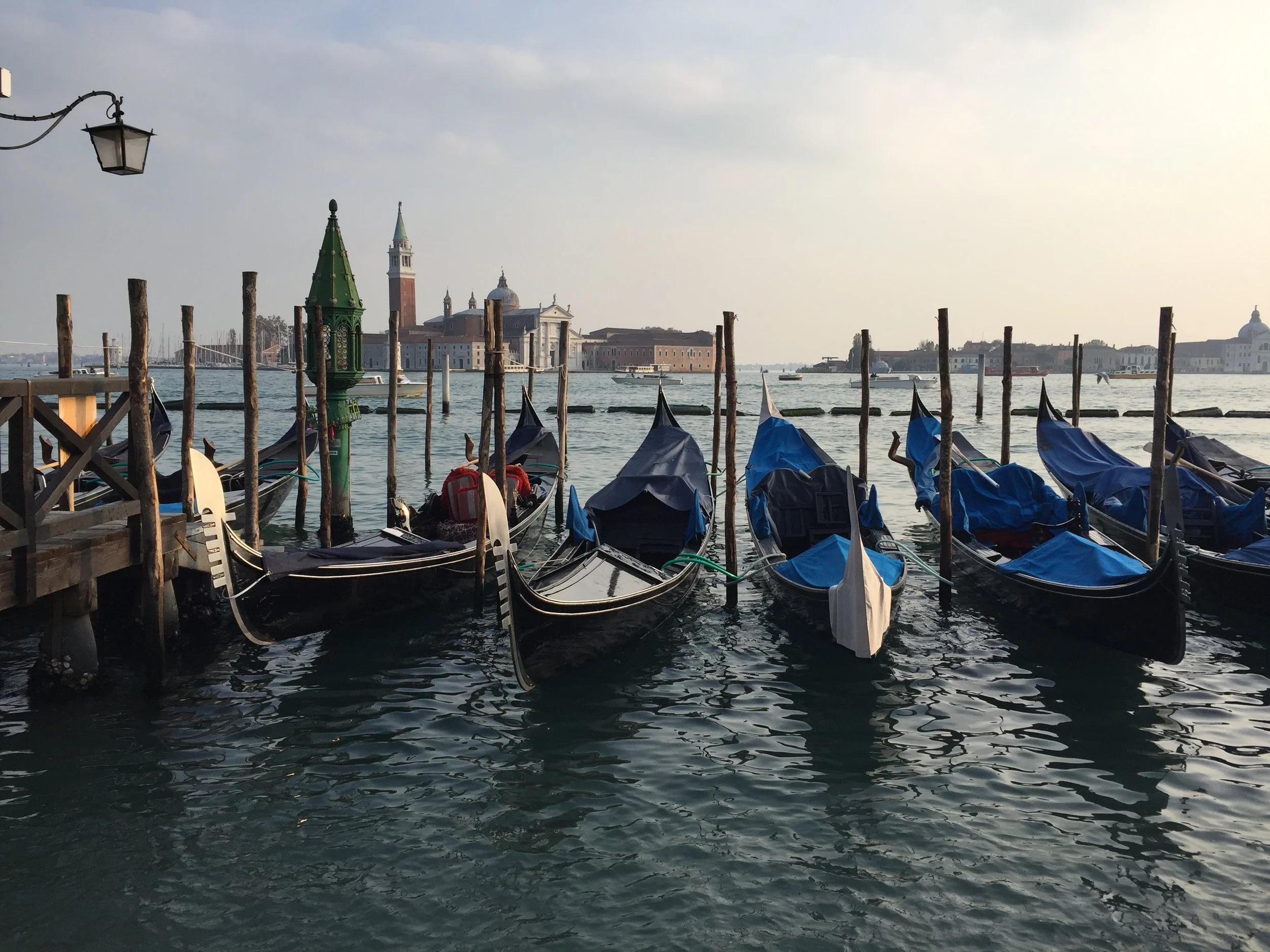 Gondolas float in the ocean EAT.PRAY.MOVE Yoga | Venice, Italy