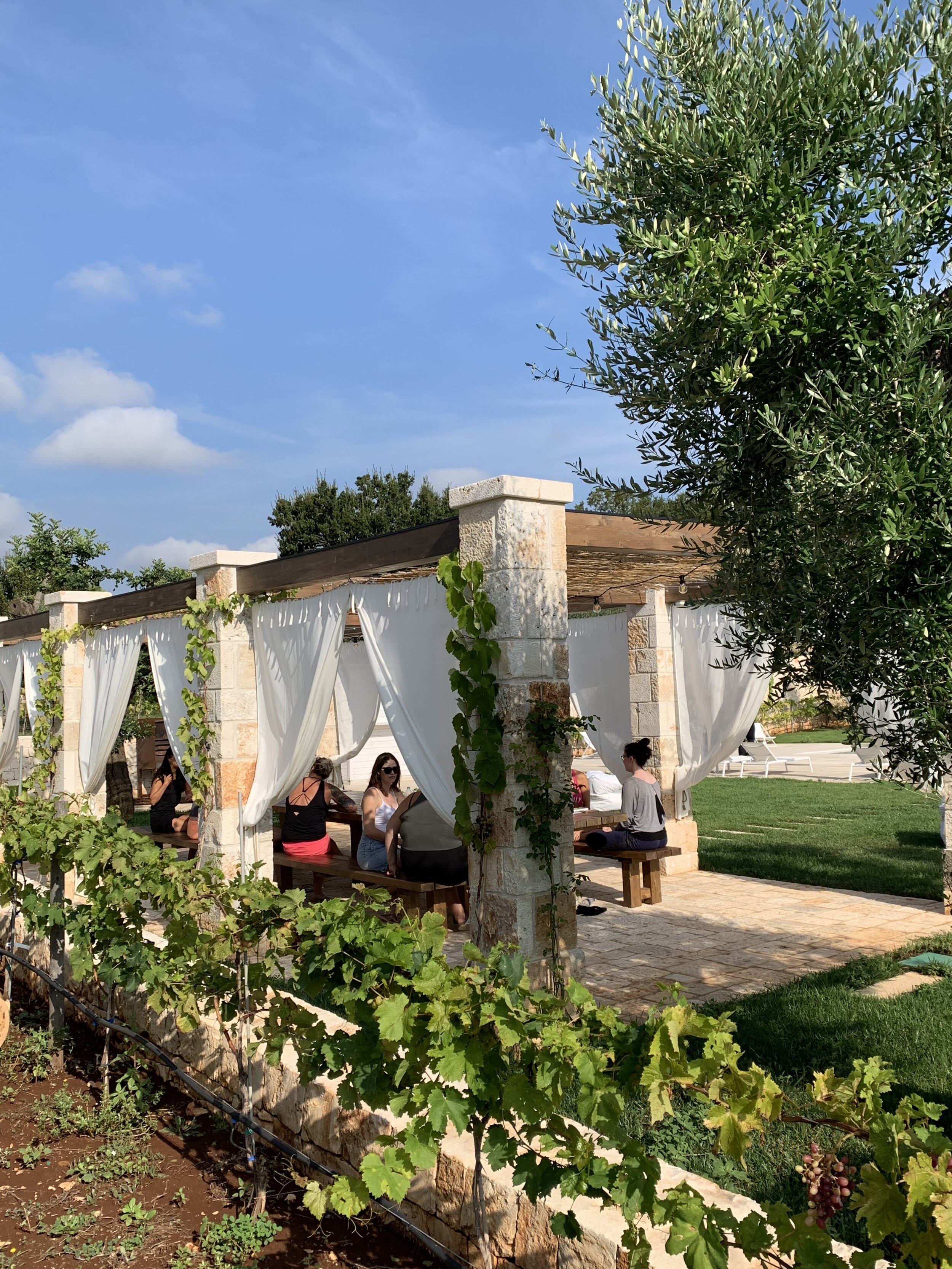 Guests taking a class in the breeze | EAT.PRAY.MOVE Yoga Retreats | Puglia, Italy