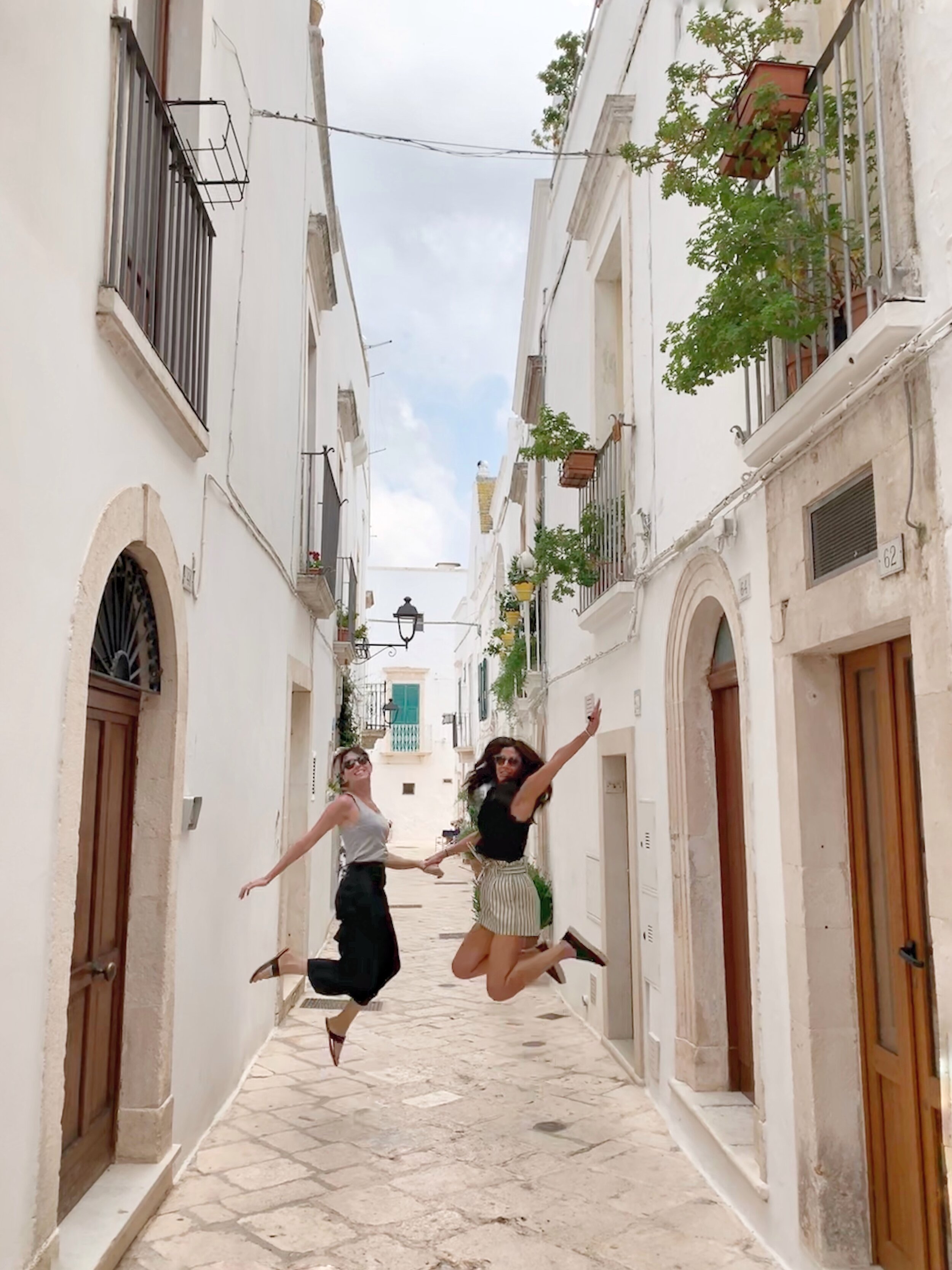 Jumping for joy in Ostuni | EAT.PRAY.MOVE Yoga Retreats | Puglia, Italy
