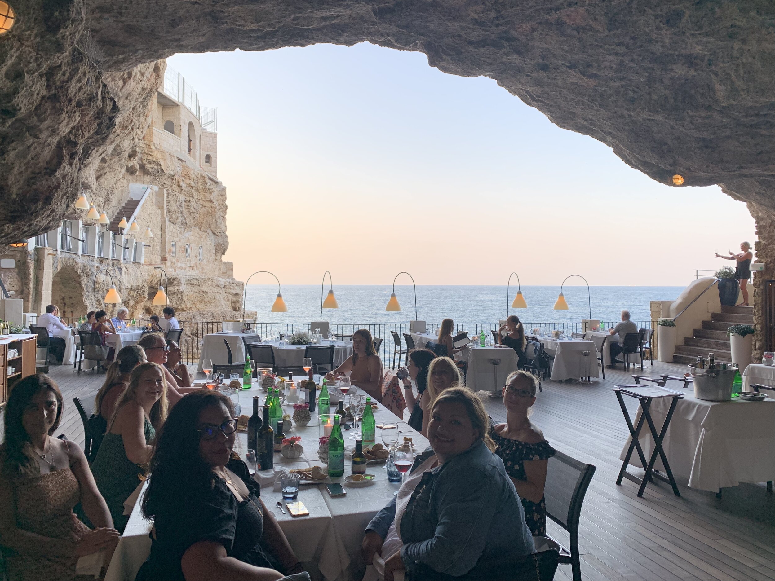 Guests dining in a grotto restaurant | EAT.PRAY.MOVE Yoga Retreats | Puglia, Italy