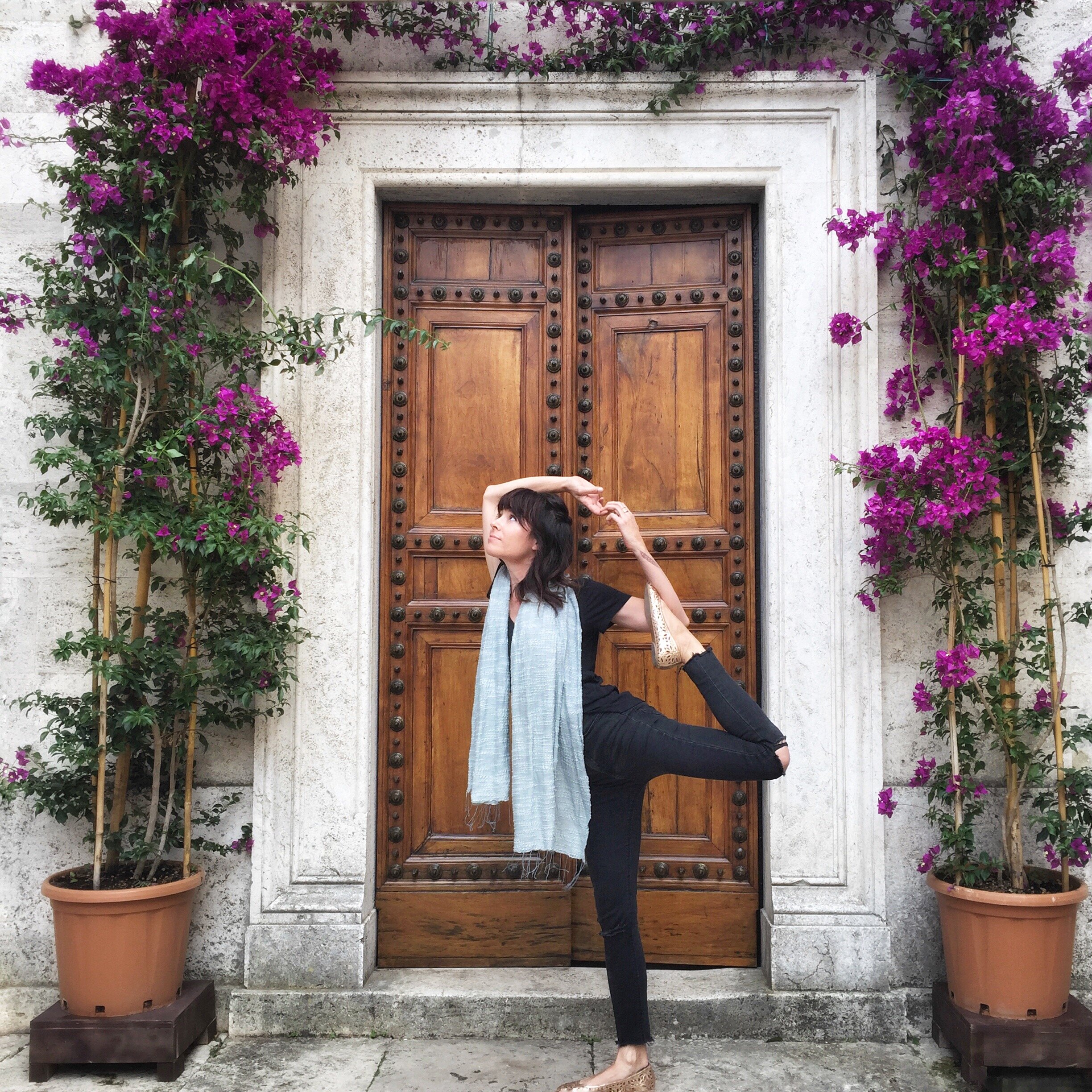 Dancer's pose in the town streets  | EAT.PRAY.MOVE Yoga Retreats | Tuscany, Italy