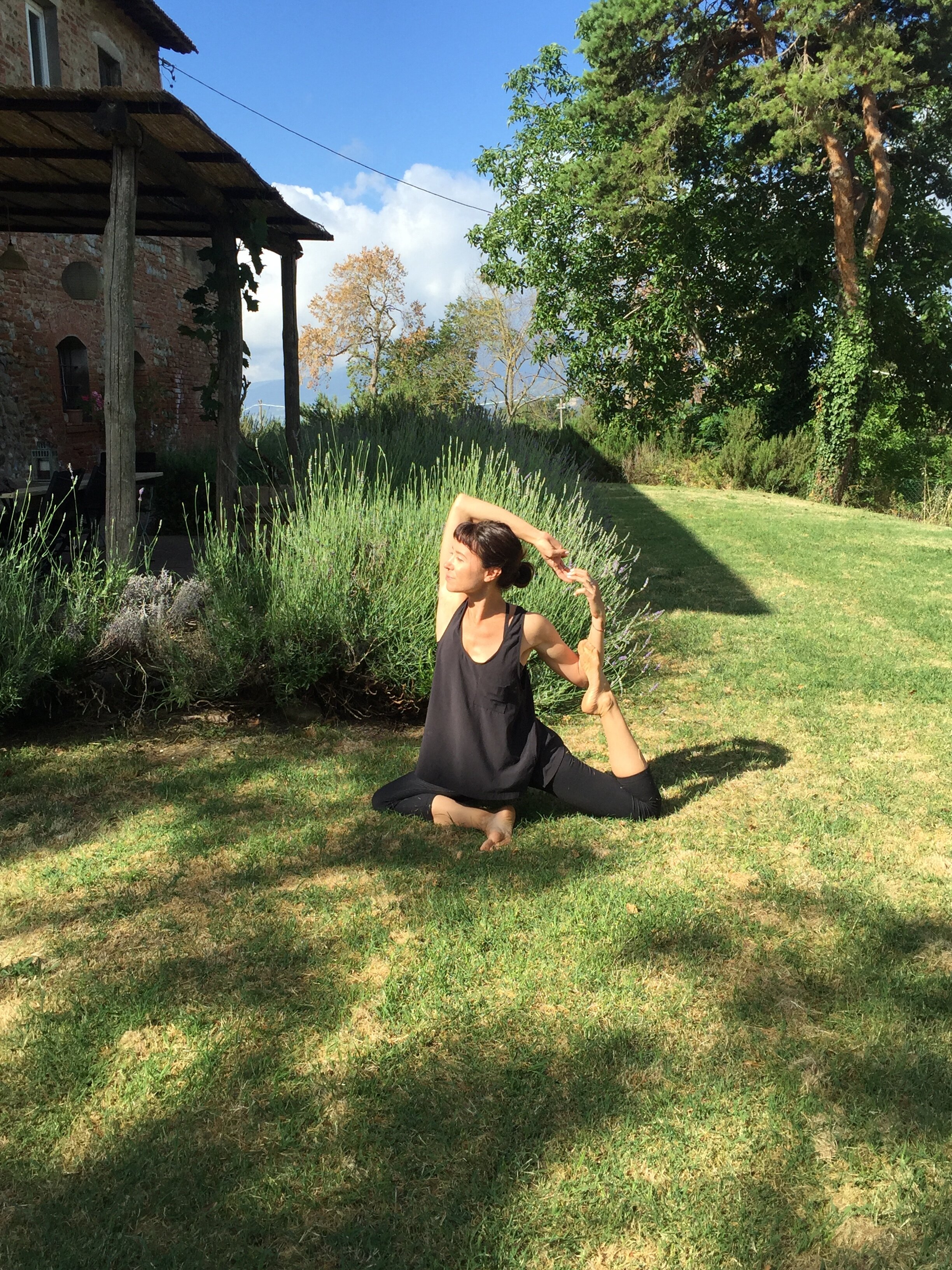 Pigeon pose by the lavender  | EAT.PRAY.MOVE Yoga Retreats | Tuscany, Italy