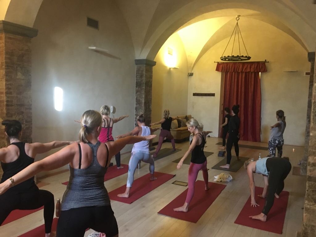 A yoga class on retreat in Chianti, Italy 