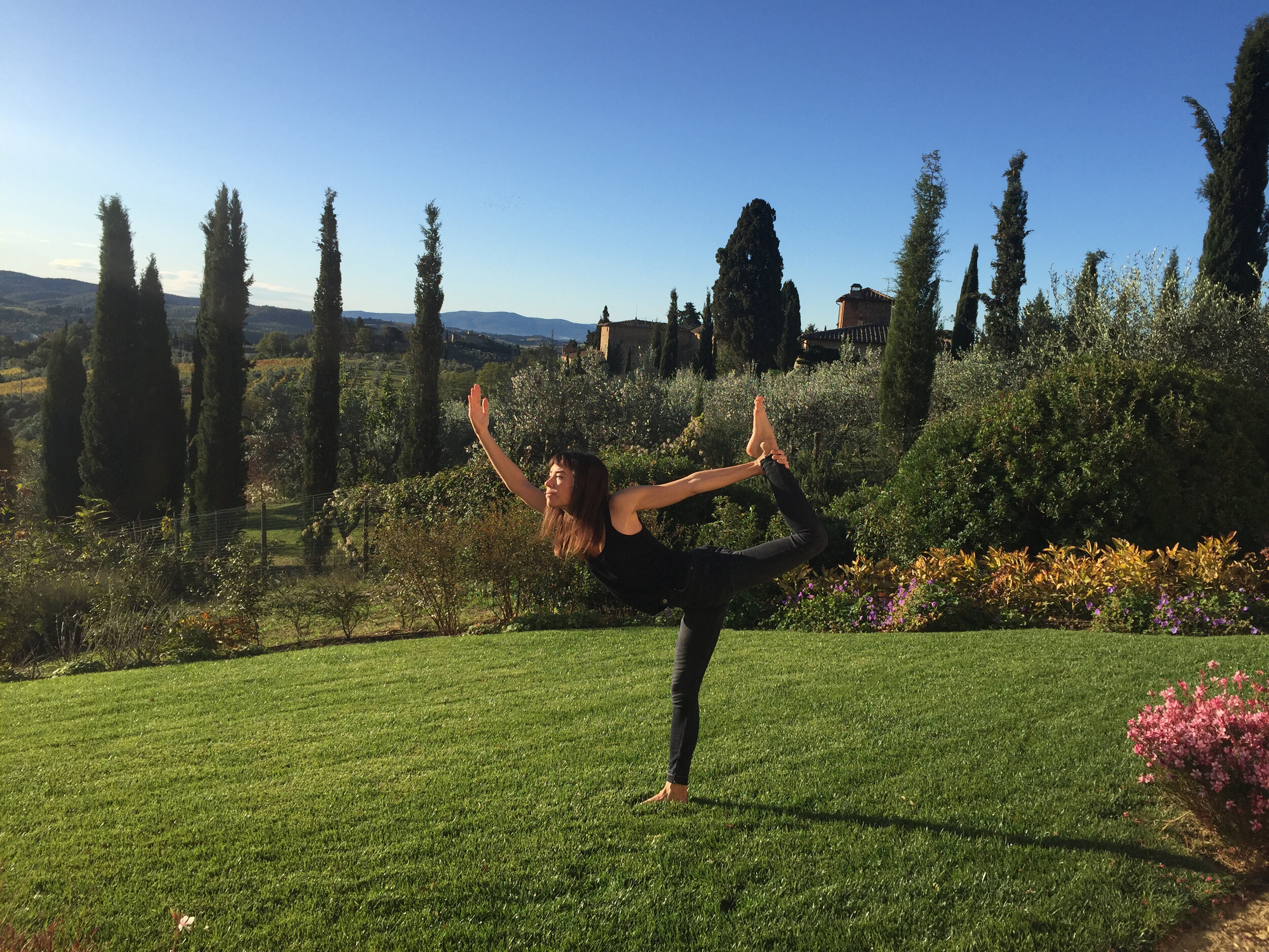 Dancer's pose on retreat in Chianti, Italy  