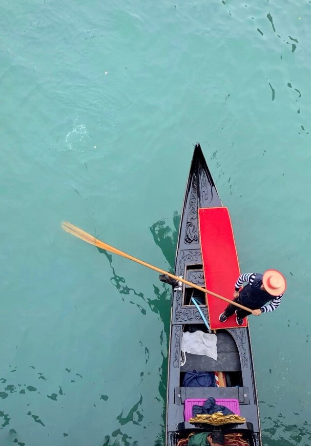  A gondolier in Venice, Italy on a yoga retreat 