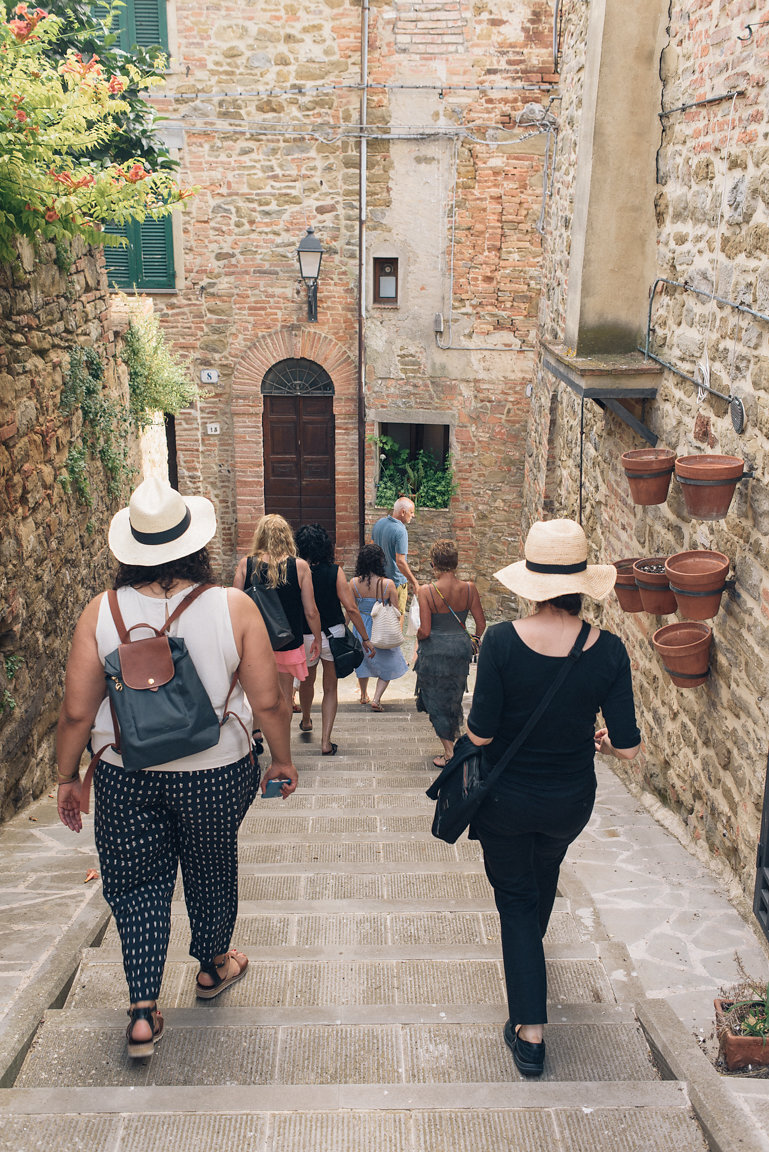  Guests on a yoga retreat exploring local towns in Tuscany, Italy 