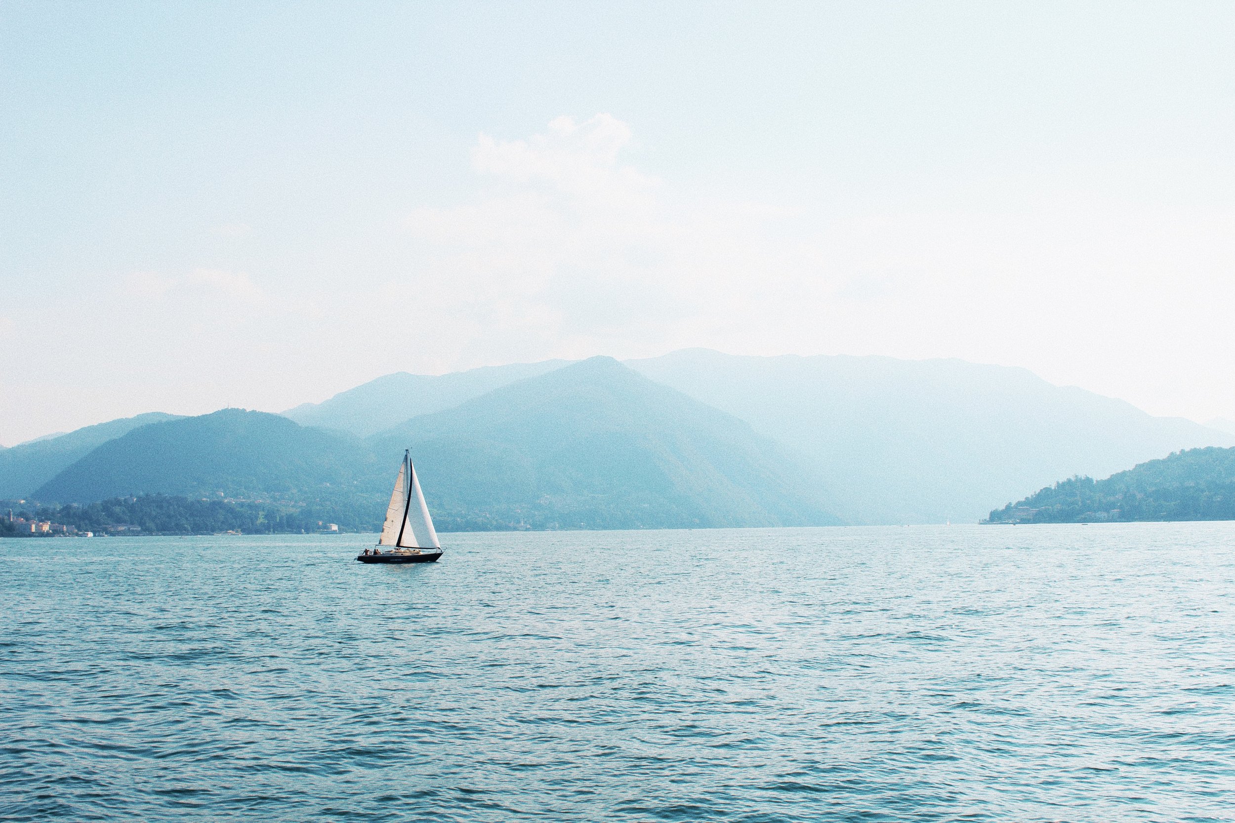 Boat on still waters  | EAT.PRAY.MOVE Yoga Retreats | Lake Como, Italy 