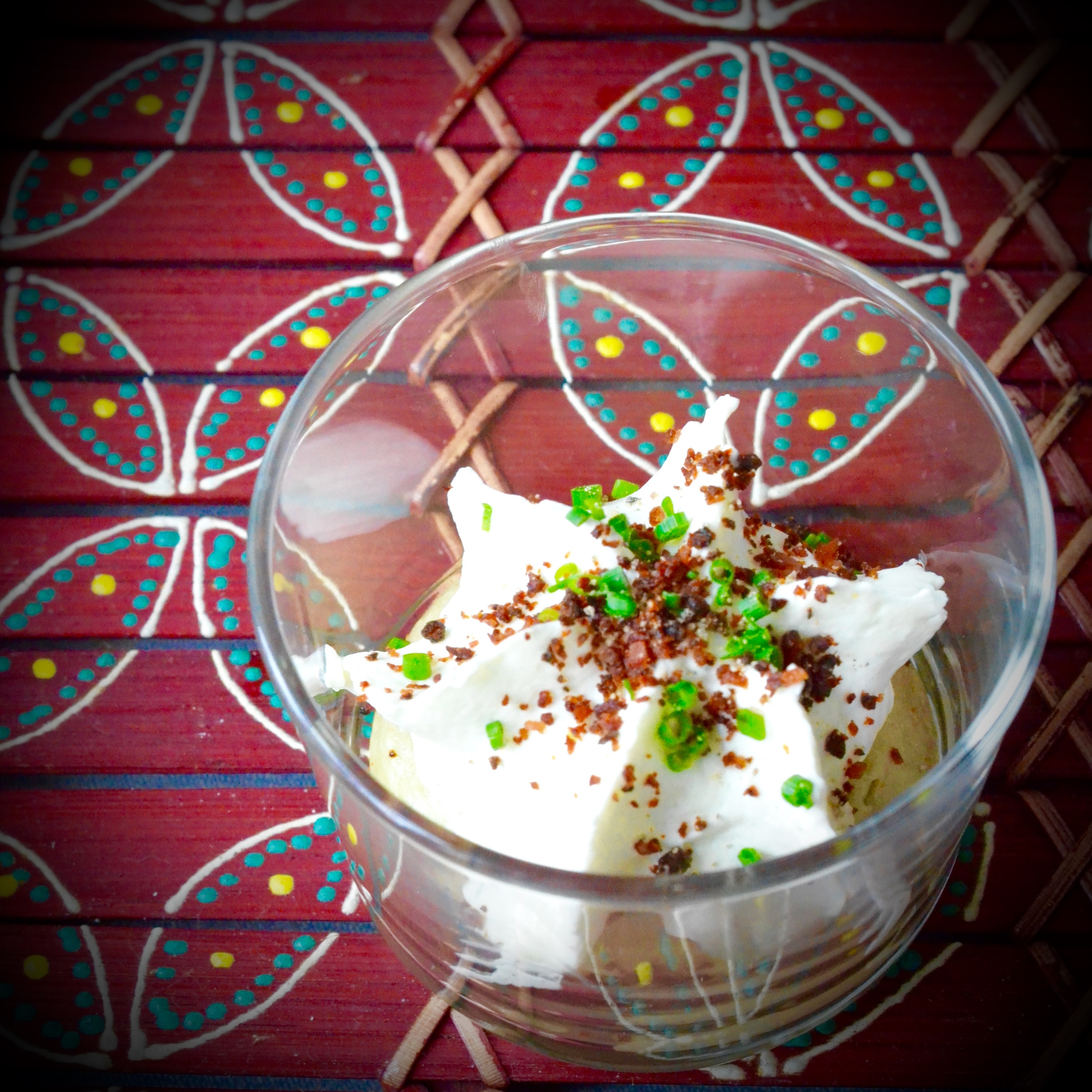 Hibiscus Dinners finger food: avocado cream with goat cheese mousse and bacon sprinkles