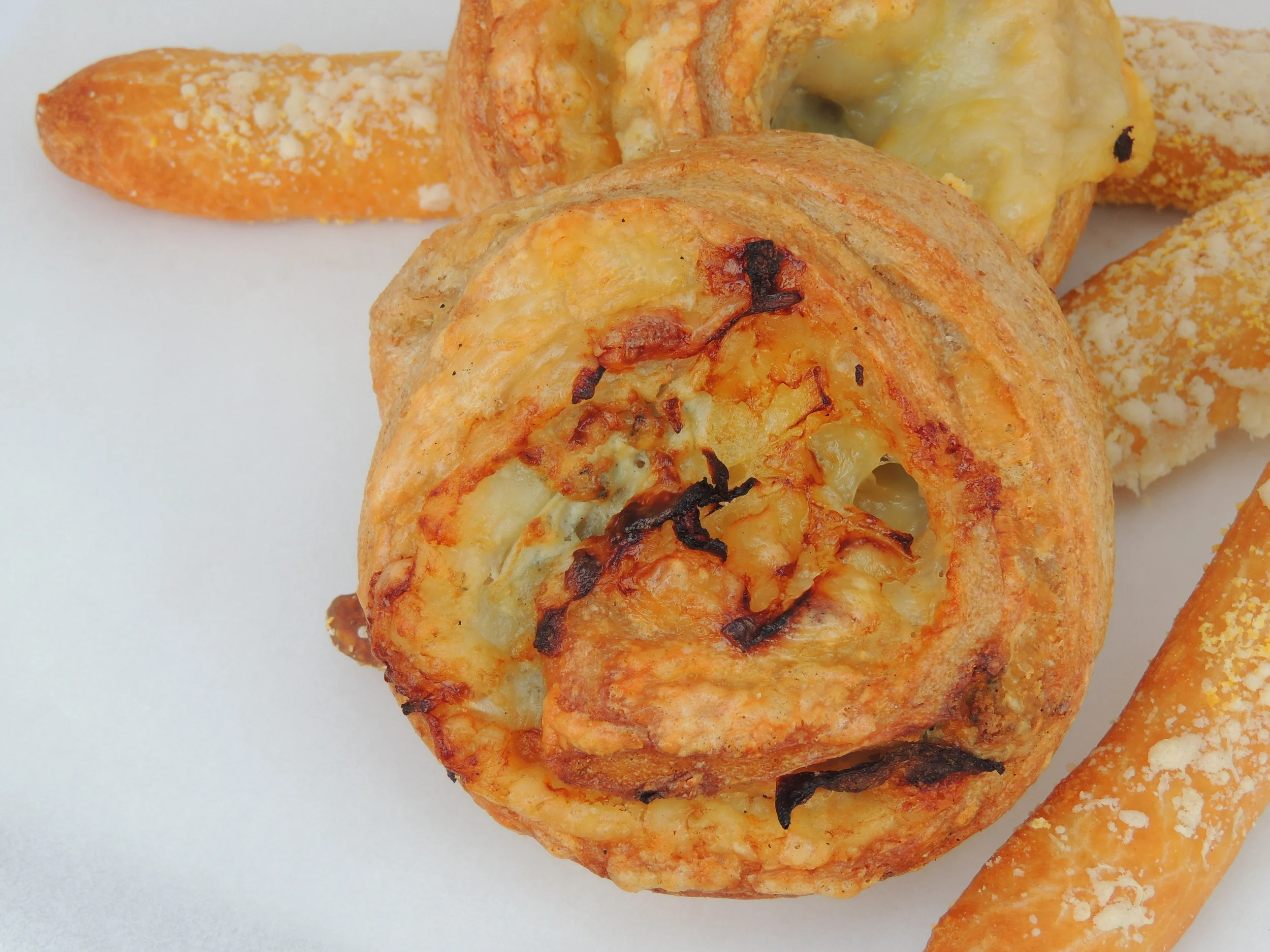 Our x-roll, cheese roll, and grissini breadsticks. Come try something savory.