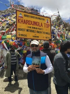International businessman Vinod Rangra reading The Oasis Within in the Himalayas, at over 18,000 feet. Cultivating his own oasis.