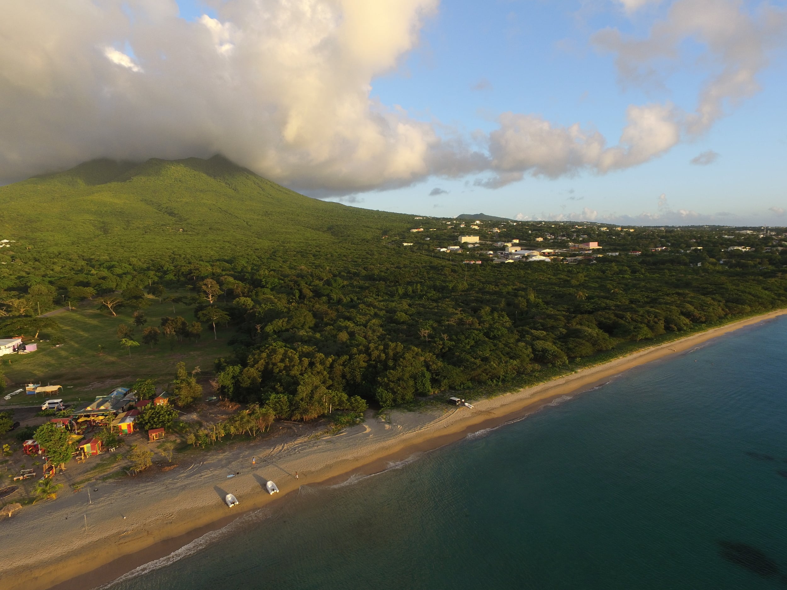 // Nevis →<p>All that awaits us on Nevis is an empty beach, a bar called "Sunshine's" and a Four Seasons hotel. Paradise defined.</p>