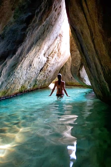 // The Baths →<p>Explore this geological wonder with natural grottos formed by huge boulders on Virgin Gorda.</p>