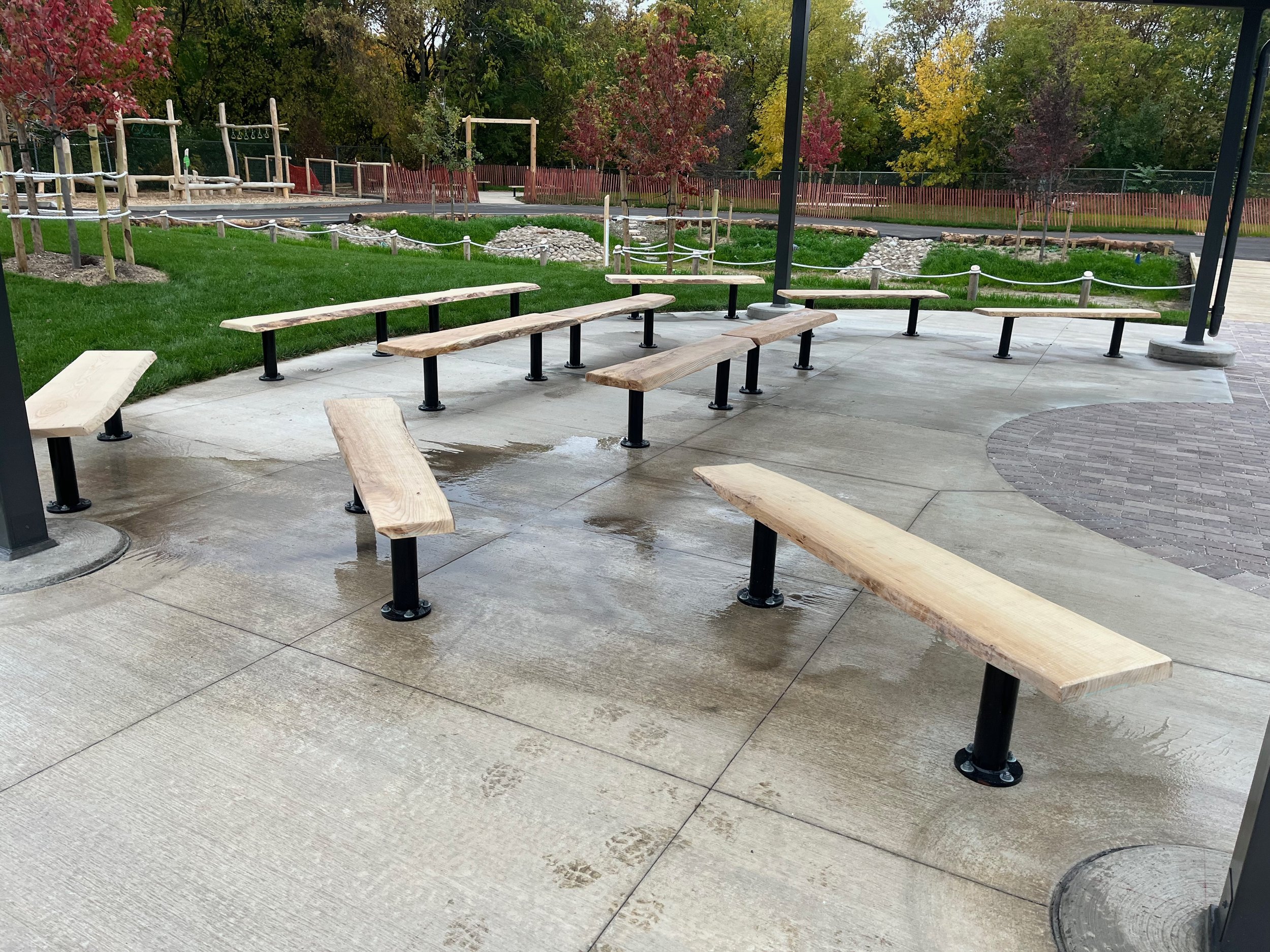 Outdoor classroom with urban wood benches at a redeveloped schoolyard
