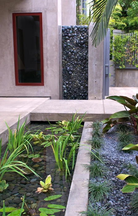 River Rock Water Wall + Lily Pond