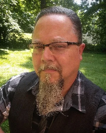Larry D. Thacker is a Kentuckian writer and artist living in Johnson City, Tennessee. His stories can be found in past issues of The Still Journal, Pikeville Review, Fried Chicken and Coffee, Dime Show Review , Vandalia Journal , Grotesque Quarterly, and Story and Grit. His poetry is in over one-hundred-and-fifty publications including Spillway , Still: The Journal , Valparaiso Poetry Review , American Journal of Poetry , Poetry South, The Southern Poetry Anthology, and Appalachian Heritage. His stories have been nominated for Pushcart and Best of the Net recognitions. His books include Mountain Mysteries: The Mystic Traditions of Appalachia, and the poetry chapbooks Drifting in Awe and Memory Train , as well as the full collections Drifting in Awe and Grave Robber Confessional . Another full collection, Feasts of Evasion , is forthcoming in later 2019. Visit his website at: www.larrydthacker.com