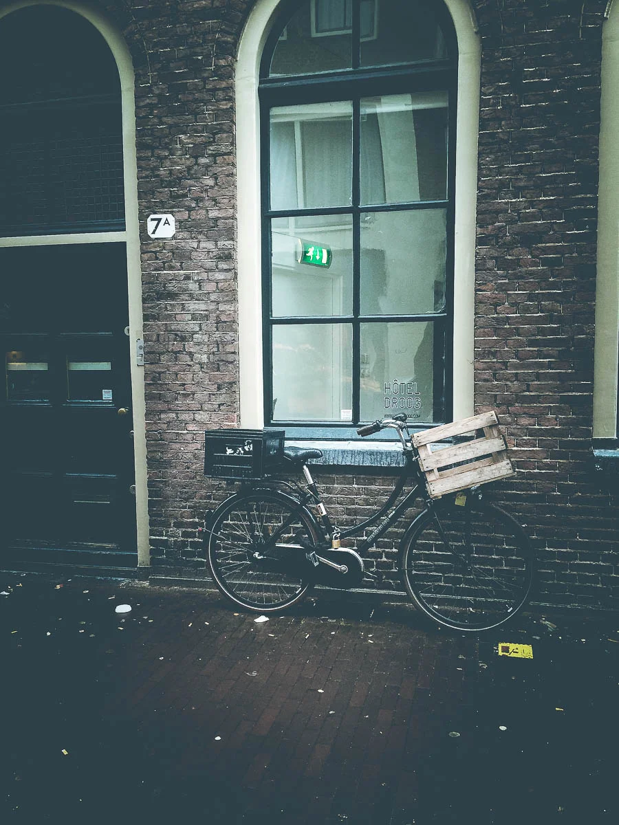 bike-against-brick-amsterdam-europe-bicycle-holly-postler-available-print.jpg
