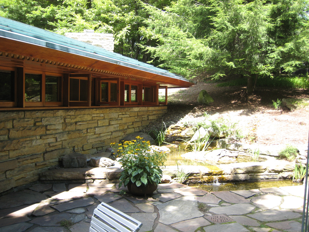 The windows open to the pond & wonderful patio filled with sculptures.