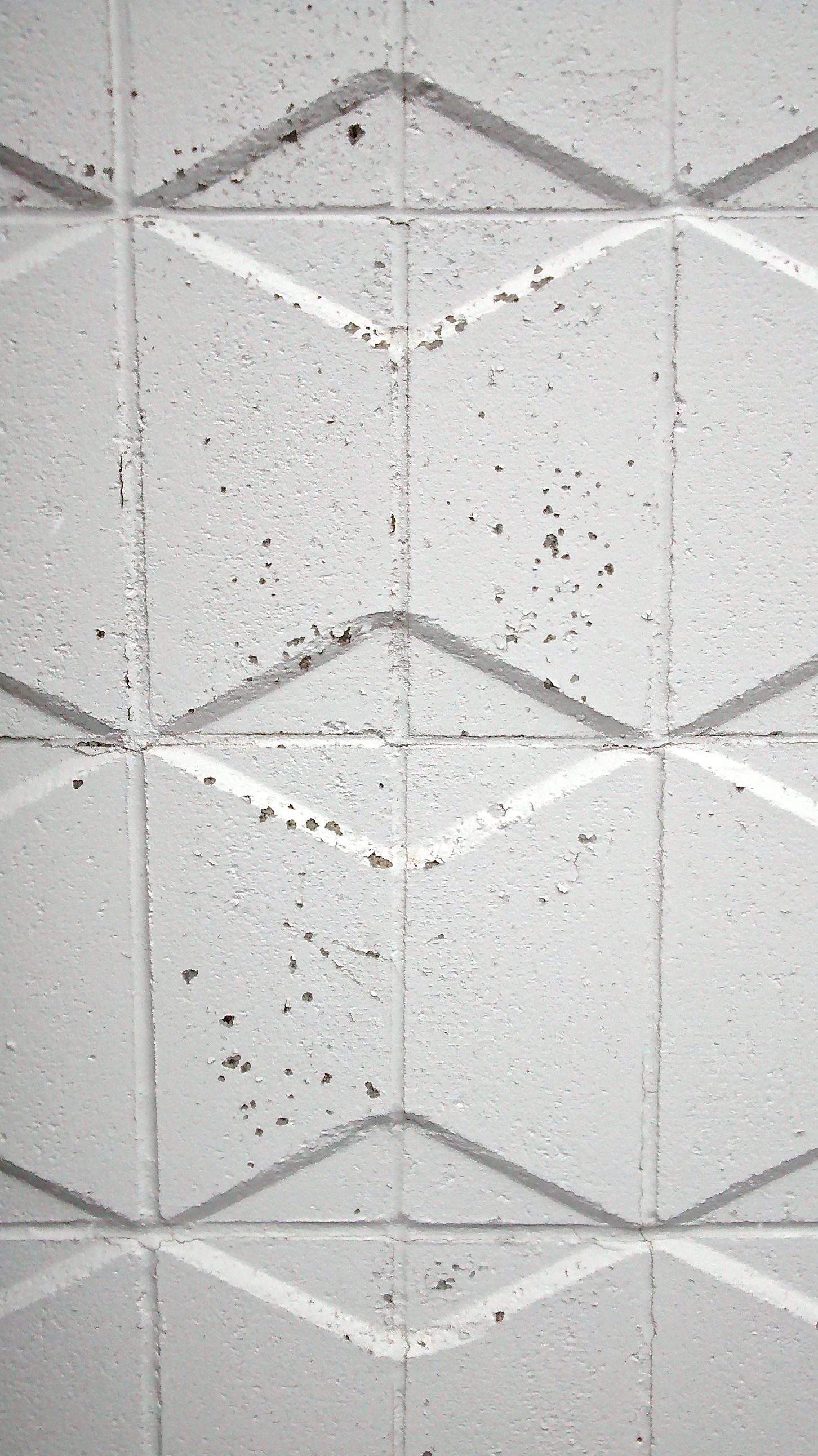 I got rear ended a few weeks ago and my van needed a new bumper. The day I pulled into the parking lot at the body shop this wall was in front of me. I snapped a quick photo on my phone & then went inside. This pattern is so retro and if you didn't already know I enjoy anything mid century. The architecture of the building and the furnishings inside were from the 70's. The front desk was walnut strips with olive green formica. Even though the whole experience of being in a car accident sucked, at least I smiled every time I pulled up.