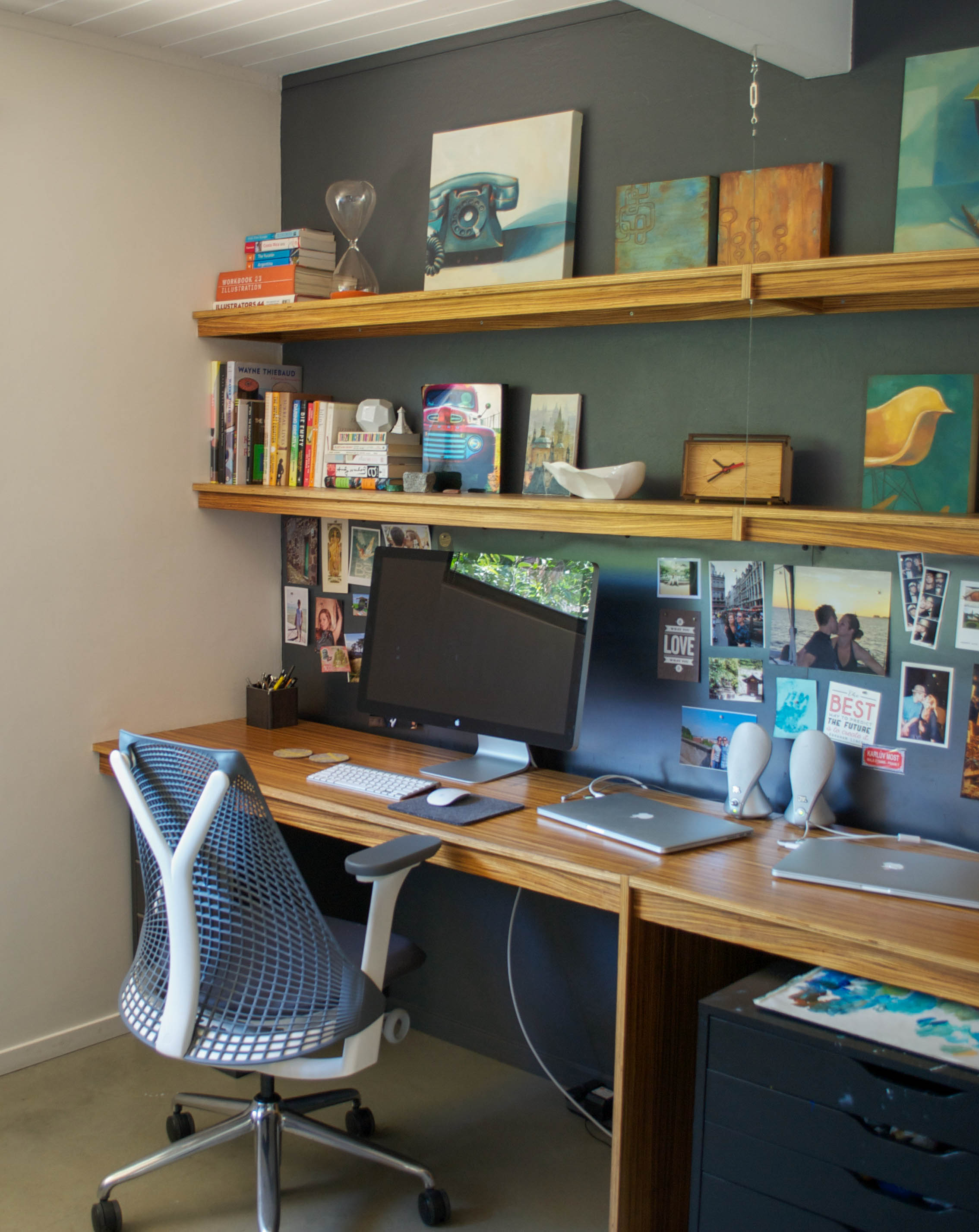 The office and studio space where Laura paints showcases some of her oil paintings and collectibles. "My work is inspired by the classic California dream and timelessness of modern design from the mid 20th century. I focus on luminous color interactions, and iconic shapes that give glimpses of the idyllic California lifestyle."