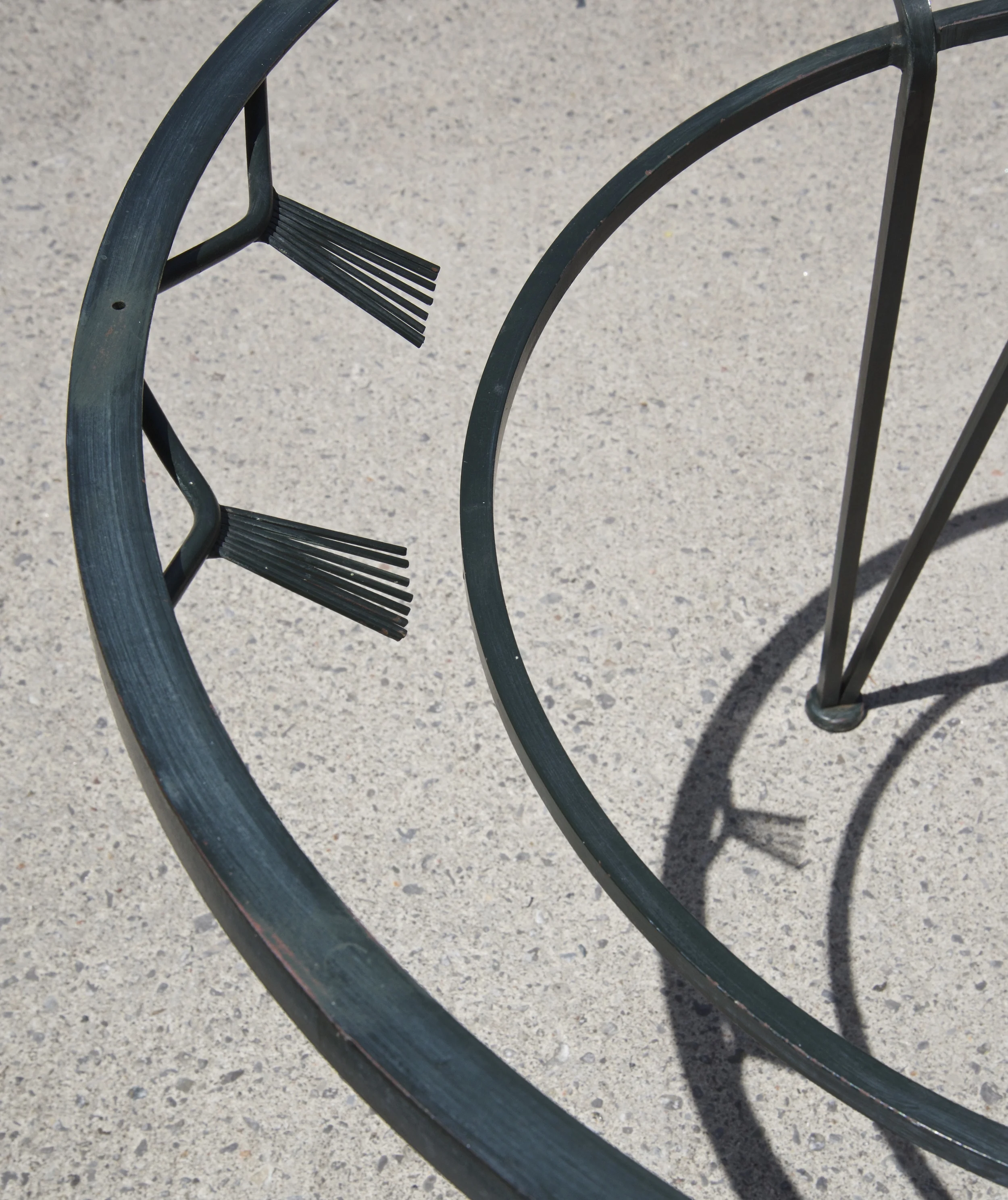 The ad had it listed as an Art Deco style, I never tried to research it to see if that was accurate. I do love these metal details that remind me of fans. My daughters noticed them as soon as we brought it inside.