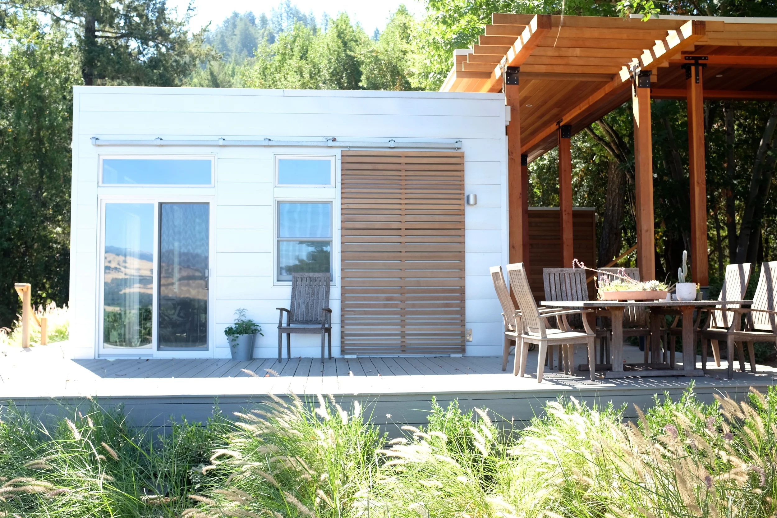 The outdoor dining area acts as an extension to the main living space.