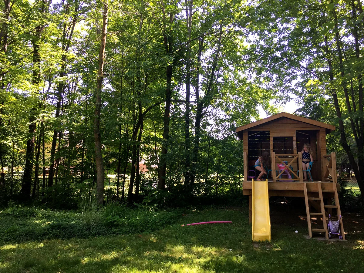 I can see how Ashley's family were sold on this outdoor living space. A large lot with trees, privacy and a play house, what more could you ask for?