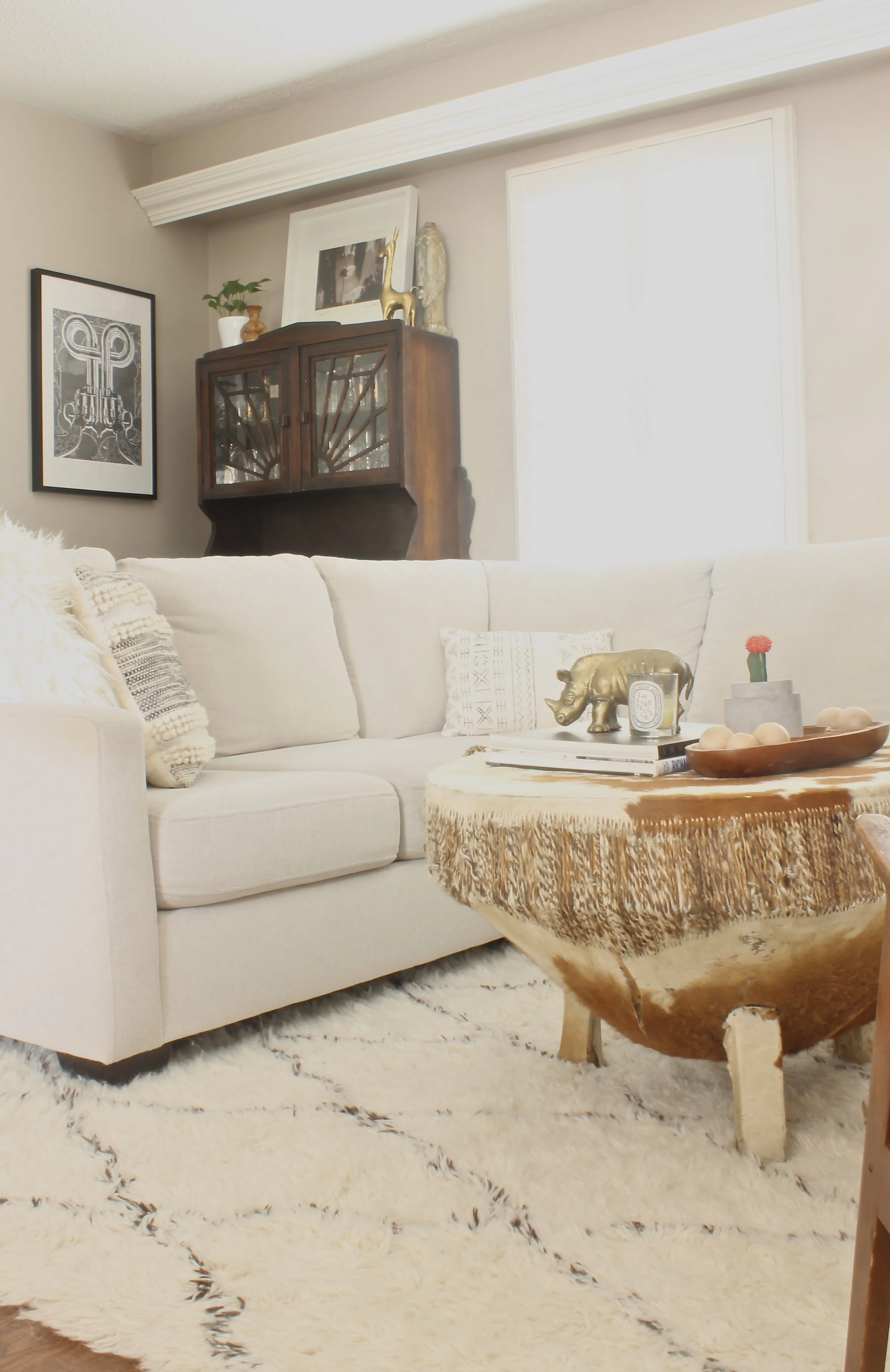 This unique coffee table was one of Jo's latest finds. I love how she layers texture into her space and adds pops of colour with greenery.
