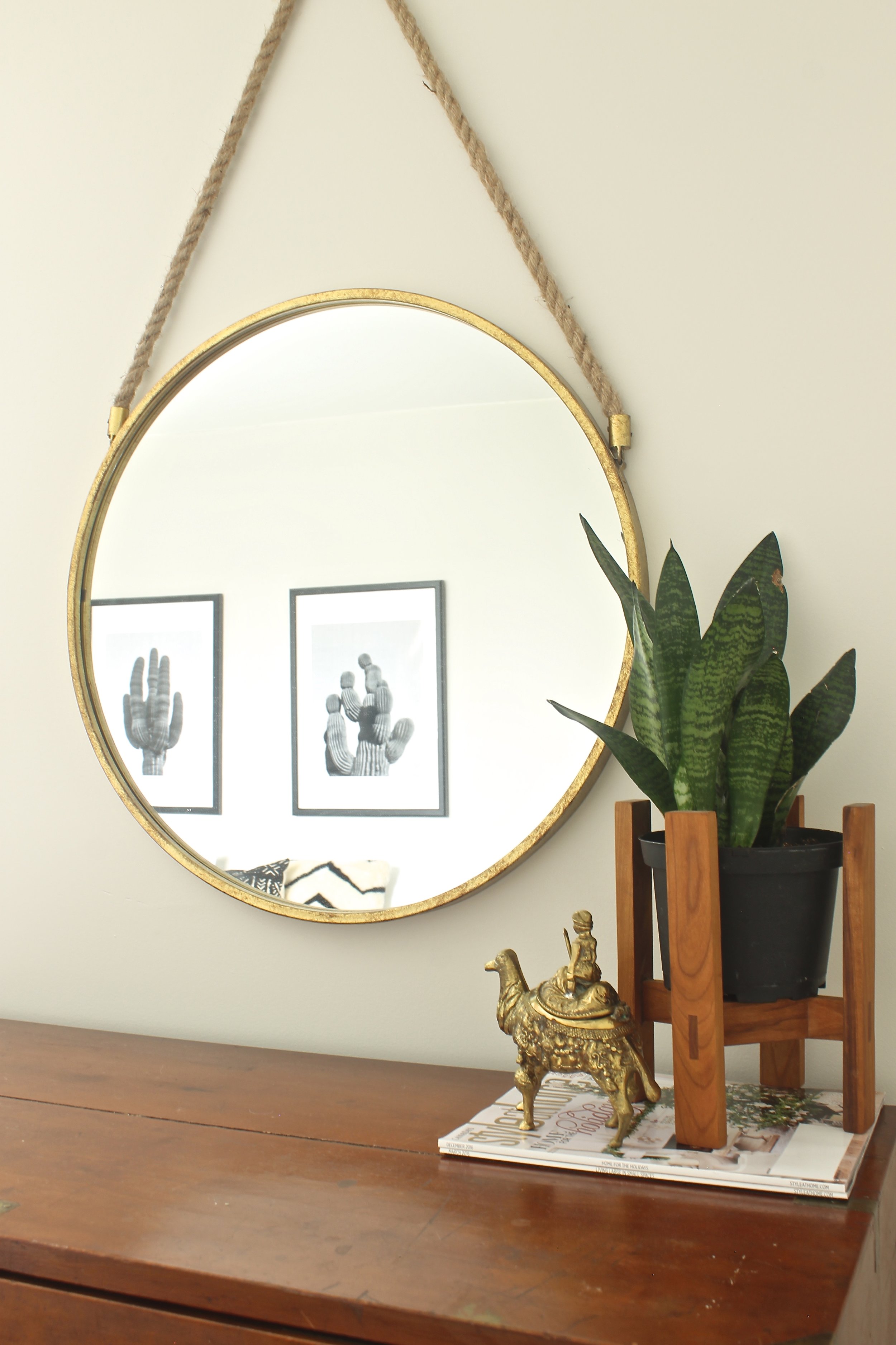 The graphic black & white prints above the bed pop against the white wall.