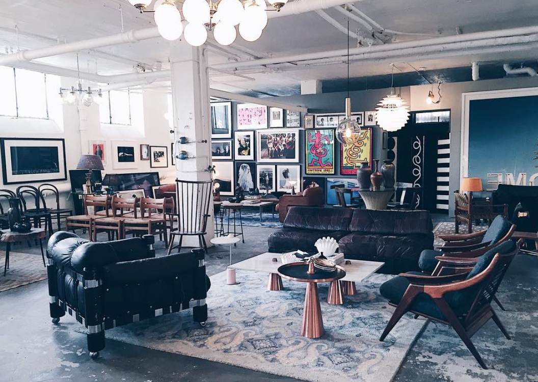 The lines on each piece of furniture are crazy & those Keith Haring pieces are jumping off the gallery wall at me!