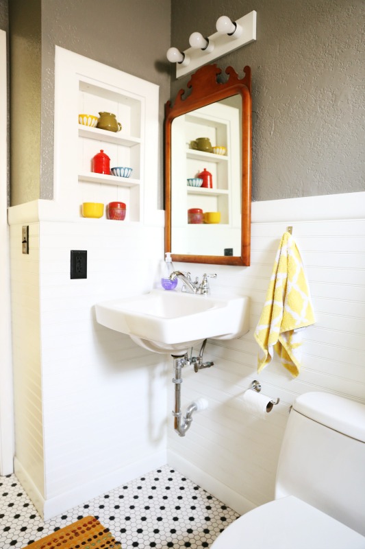 "We went with a floating sink to open up this tiny bathroom."